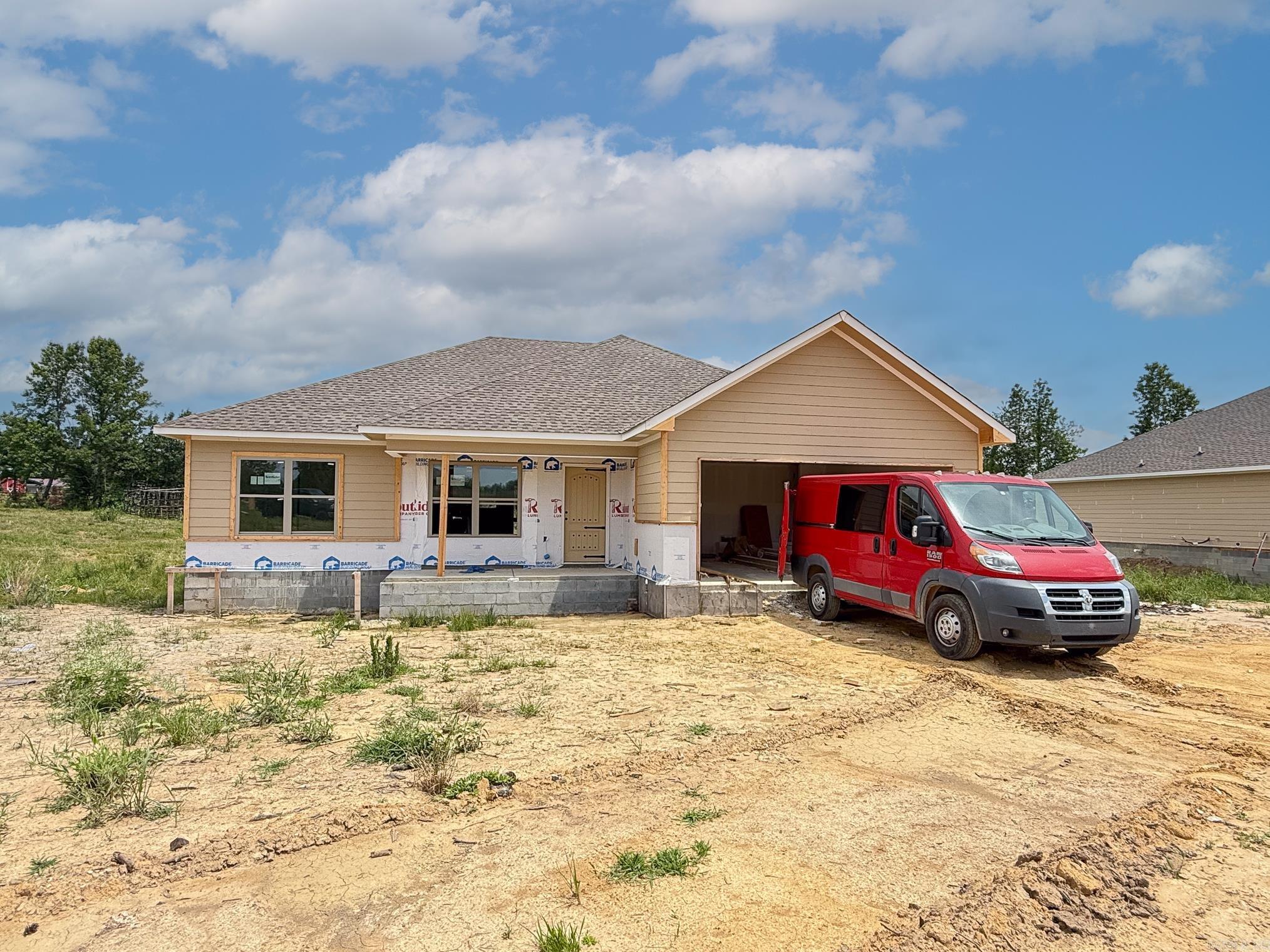 Beautiful new construction home situated on a spacious 1-acre lot! This open-concept design features stunning brick, rock, and Hardie board exterior finishes, a spacious kitchen with farmhouse sink and abundant cabinet storage, and a stylish accent wall that adds character throughout. The private primary suite offers a luxurious soaker tub and separate walk-in shower. Enjoy tile flooring in all bathrooms, a two-car garage, and a covered back patio with a gorgeous wood ceiling—perfect for relaxing or entertaining. Country living with modern finishes and thoughtful design!