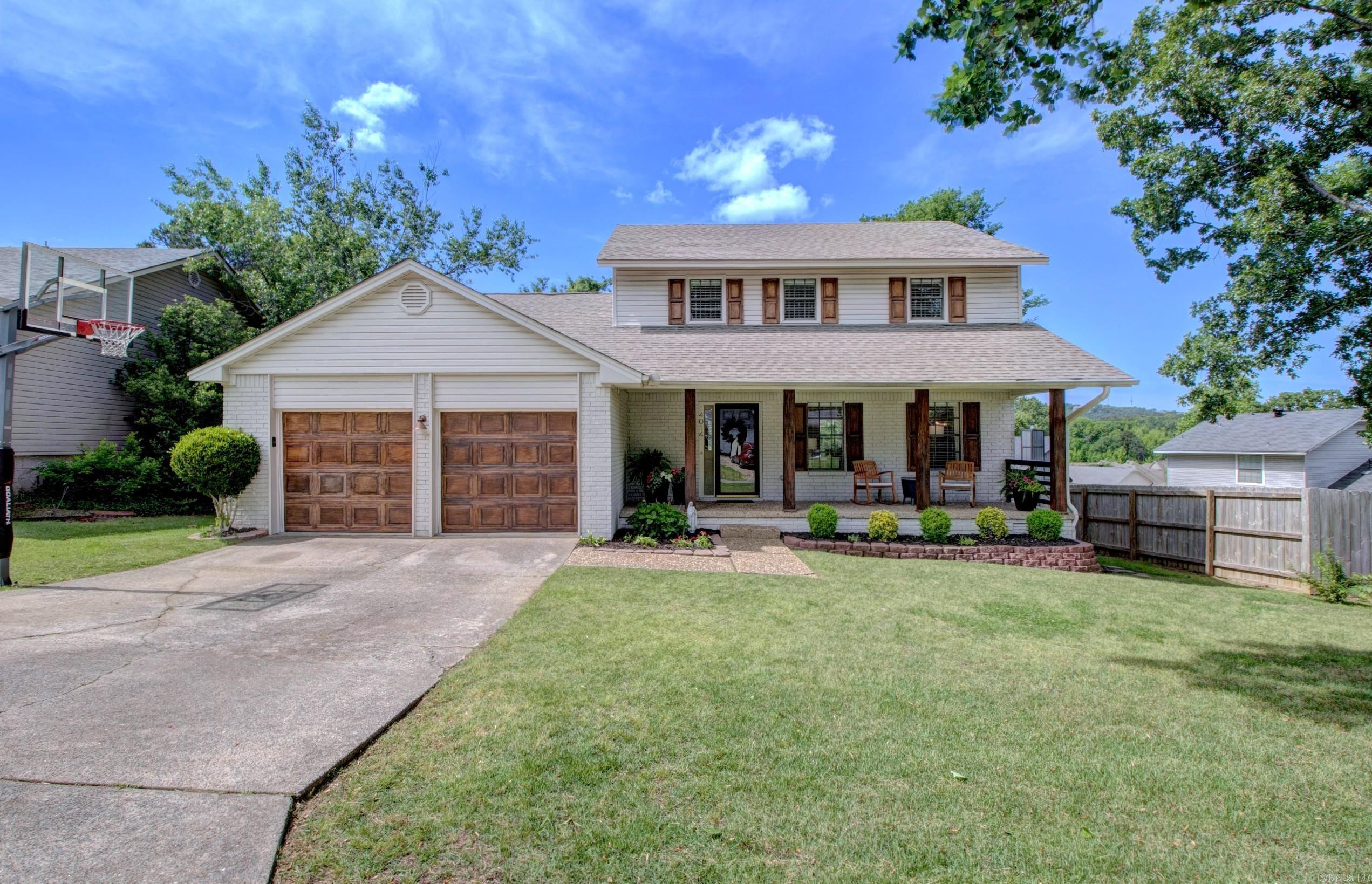 Beautifully updated traditional home in Parkway Place featuring 4 bedrooms, 2.5 baths, and approximately 2,118 sq. ft. The inviting floorplan offers multiple living spaces including a great room plus a den/family room with a fireplace,  a spacious kitchen with granite slab countertops, breakfast bar, pantry, and abundant cabinet space that opens to the dining area. Hardwood floors, neutral paint colors, and abundant natural light create a fresh, modern feel throughout. All bedrooms are located upstairs, including a spacious primary suite with updated bath. Enjoy outdoor living in the fully fenced backyard with deck, patio space, mature trees, and extra landscaping. Two-car garage, zoned HVAC, crawl space foundation. Conveniently located in West Little Rock with community amenities including pool, tennis courts, and playground; and near Chenal Parkway shopping, dining, and entertainment.  See agent remarks.