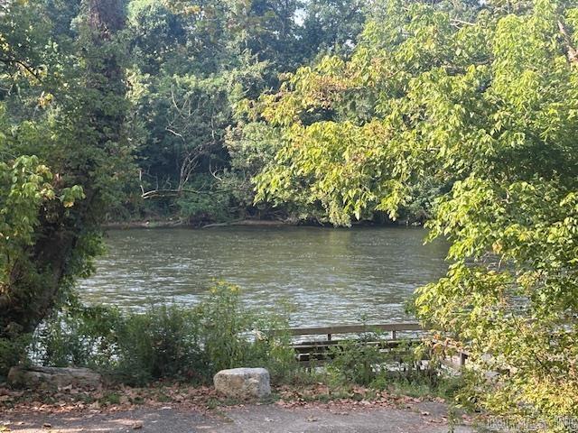 1.68-acre Norfork River lot. In town and outside a flood zone. Rare opportunity to own 1.65 acres overlooking beautiful Norfork River. Enjoy the river views and access without the worry or flooding. Prime location just inside city limits of Norfork. River access less than a mile away for fishing, kayaking or relaxing by the water. Build your dream home or getaway retreat. Whether you are looking for a private escape, a full-time residence, or an investment in one of Arkansas’ most scenic river towns, this property has it all.