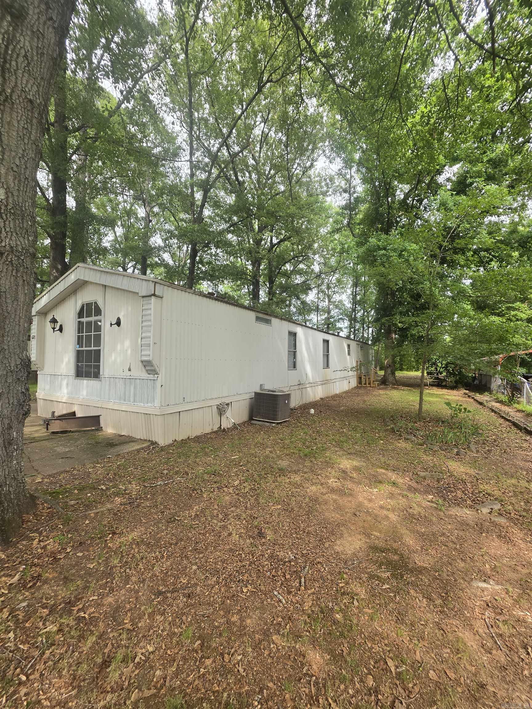Owner financing available!  This fully remodeled mobile home features 3 bedrooms and 2 bathrooms, offering a spacious and modern living space. The open-concept layout includes updated flooring, fresh paint, and upgraded finishes throughout. The kitchen has been renovated with contemporary cabinetry, countertops, and some appliances for both functionality and style. Situated on a 0.27-acre lot, the property provides plenty of outdoor space for entertaining, or personal additions like a garden or play area. Conveniently located near shopping areas and schools.