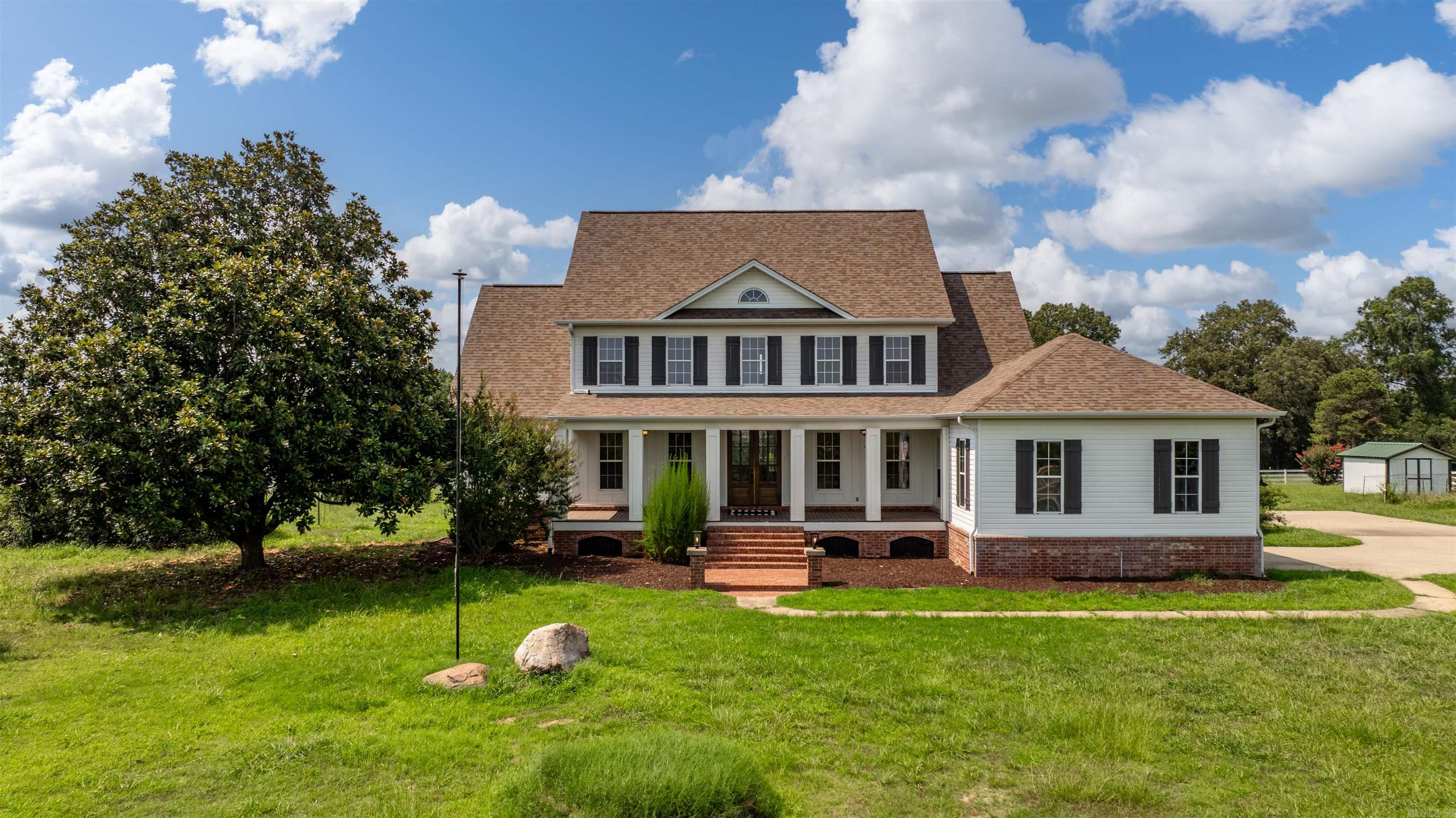 Nestled on 10 acres, this home is an incredible blend of luxury and country living!  Completely renovated in 2021, it is perfection from top to bottom and packed with charm!  Custom double doors open to a bright oversized entry flanked by a formal dining room and study. Walk in to the cozy den, high ceilings and floor-to-ceiling windows.  The chef's kitchen is to die-for! Quartz countertops with a kitchen island and all luxury stainless steel appliances, it is perfect for entertaining.  Precious breakfast nook that opens to a spectacular 640 square foot covered deck.  Primary en suite bedroom down with a spa-inspired bathroom.  Soaking tub, double vanity, and walk-in shower.  4 bedrooms up.  This would make an amazing equestrian property, with a 50x50 barn on the acreage.  All utilities underground, including natural gas & fiber internet.  Come see today! Agents, see remarks.