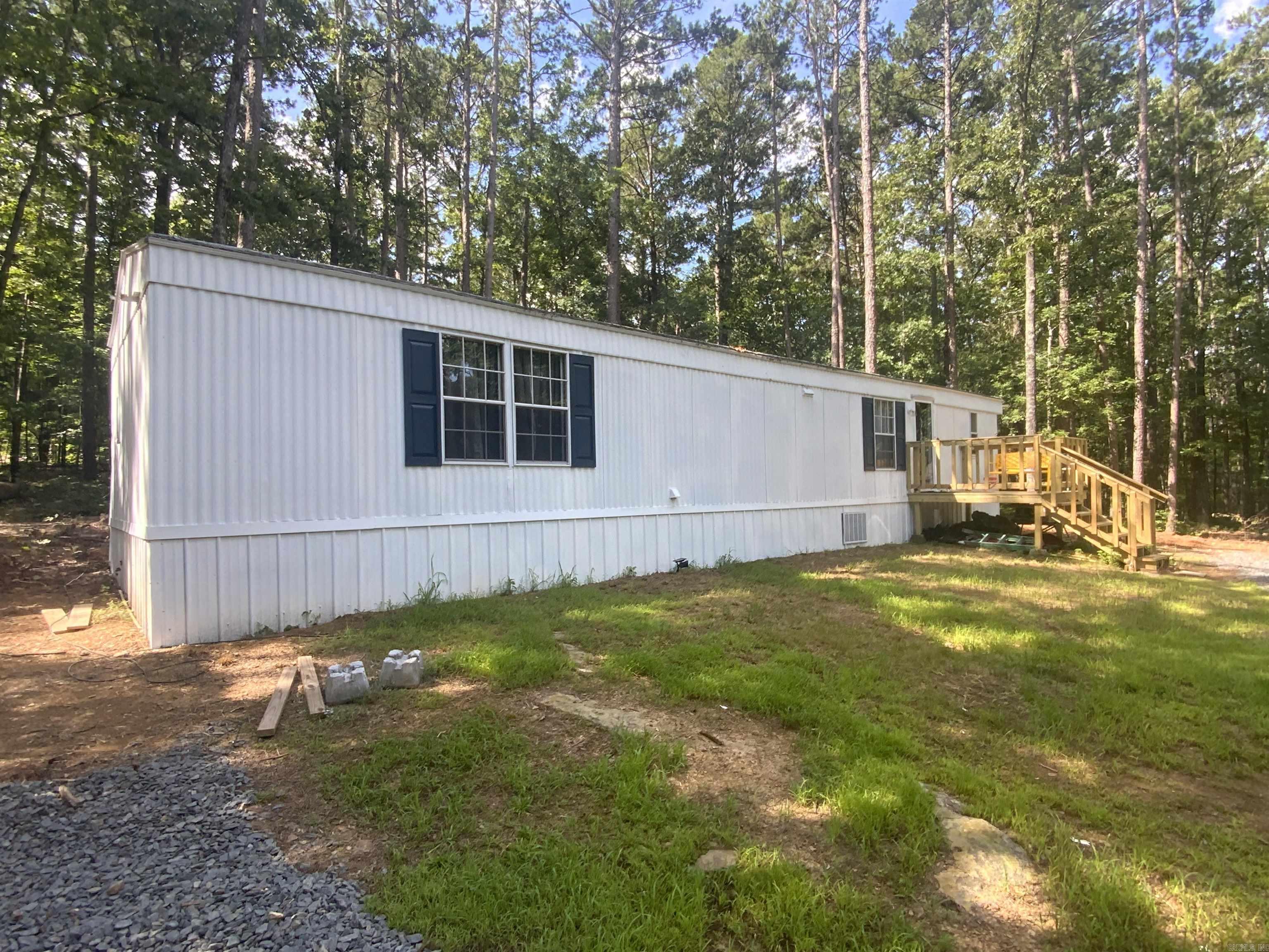 This property is close to Cherokee Park, plenty of space to add additional trailer or RV space for all of your family and friends. Mobile is newly renovated with paint, new flooring, appliances, mini split and new septic system. It is moving ready. Agents see remarks.