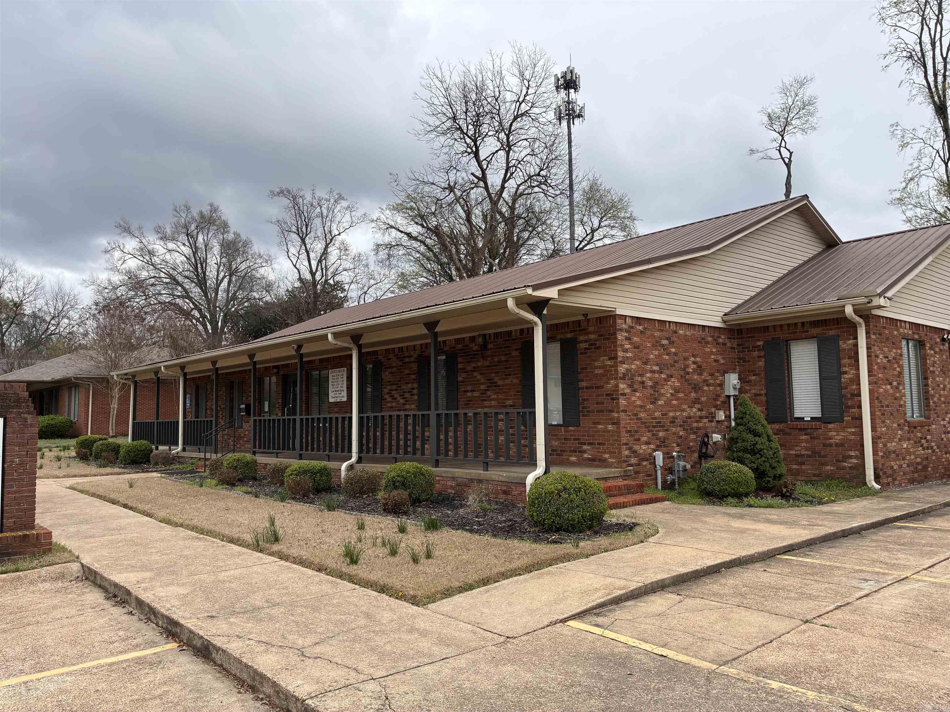 Medical Building with exam rooms and offices and restrooms. Parking lot. Roof and central unit recently replaced.