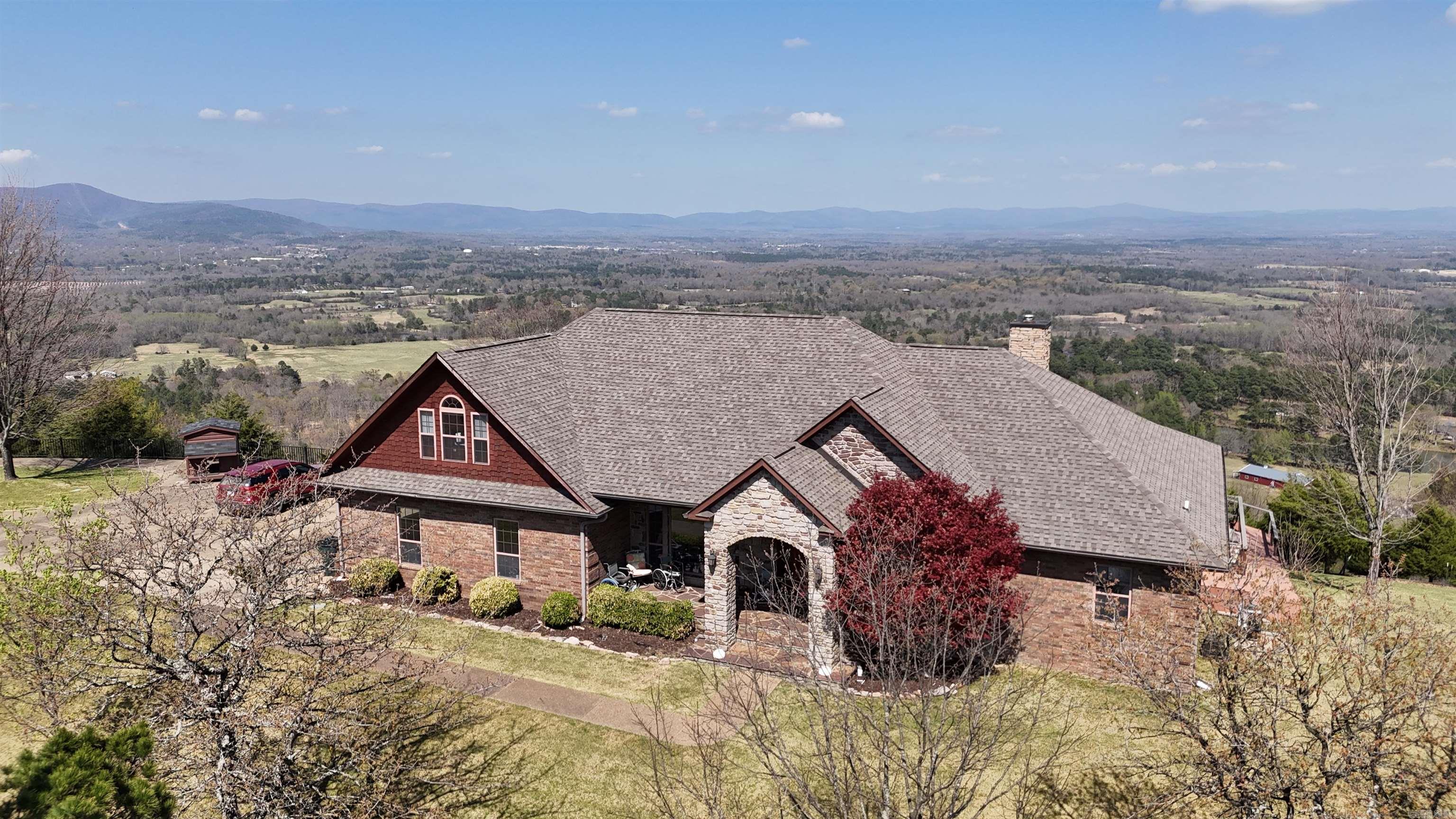 Living above the clouds! Fabulous 3/2 home on 5+ acres with above the clouds views of Dallas Valley, Rich Mountain, Highland Mountains and Shady Mountains. Home is designed for anyone, with an above ground pool with chair lift and elevator, stair chair to access upstairs bedrooms, ramp in the garage for easy access to inside home.  Whole house generator w/1000 gal. propane tank. All on paved lane from county road to house. Decks on east side of house with railings for safely. Stacked rock fireplace is propane, could be converted back to wood burning. Open concept living/dining/kitchen so you can enjoy the views from anywhere. Double oven, gas cooktop, large pantry, separate dining room, vaulted ceilings throughout. Two wells, basement, primary bedroom is separate. Lots of wildlife, including deer, bear, turkey and eagles. Only a short distance from ATV trails and Bethesda Lake.