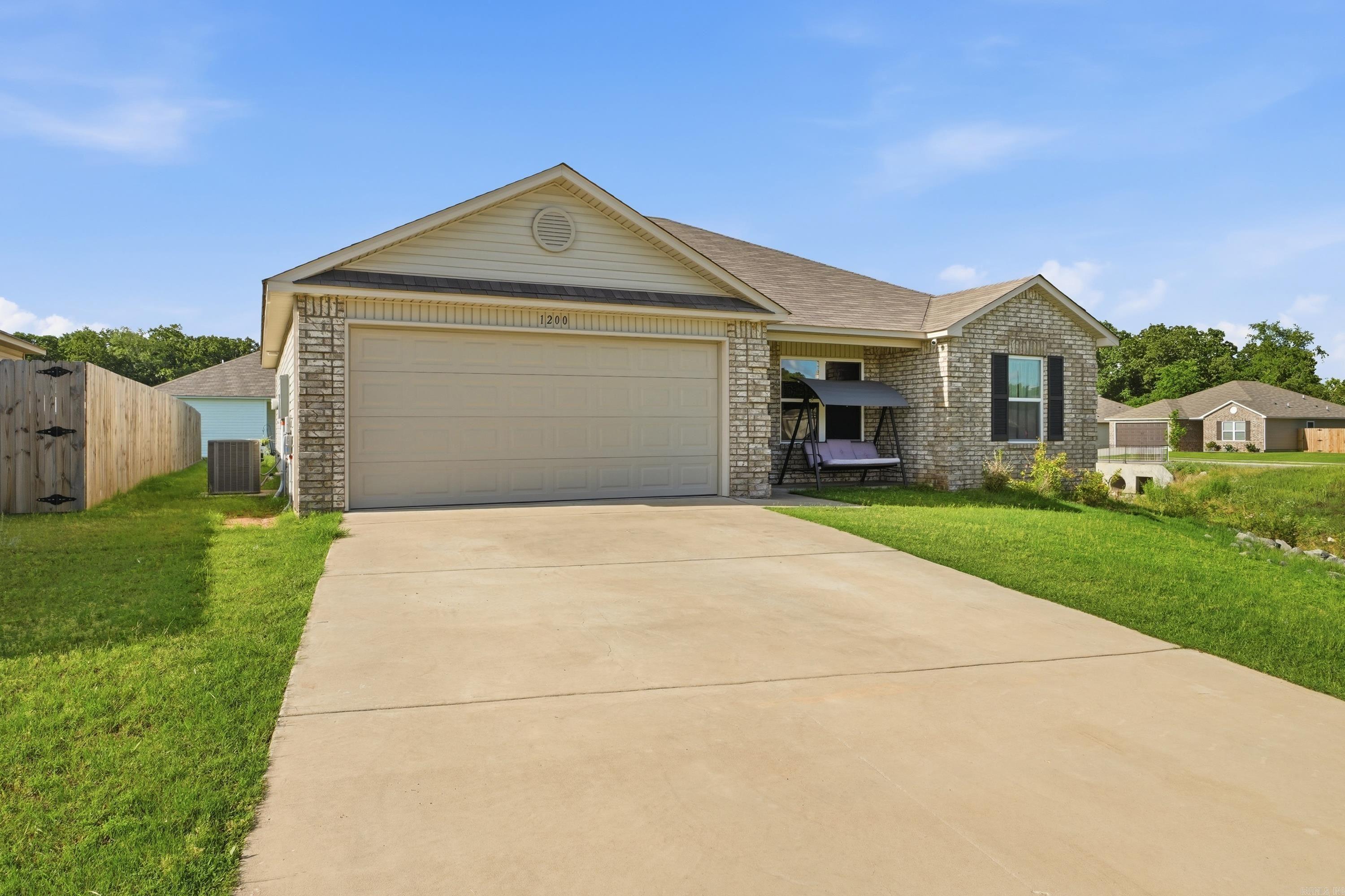Welcome home to this beautifully maintained 2023 built home featuring a functional split floor plan with 3 bedrooms and 2 bathrooms. Filled with natural light, the open living and kitchen area creates a bright and inviting space perfect for everyday living or entertaining guests. The spacious kitchen offers marble look laminate countertops, a modern color palette, and a clean, airy feel throughout the home. Thoughtful upgrades include Luxury Vinyl Plank flooring in the living room, wet areas, and adjacent hallways, Cheyenne style interior doors, and LED disk lighting in the kitchen. Situated on an oversized corner lot with additional green space, this property offers extra room and flexibility rarely found in the neighborhood. Located in the desirable Bell Valley subdivision, you’ll enjoy convenient access to shopping, dining, and all that Conway has to offer just minutes away. Move in ready and better than waiting to build, come see this one today!
