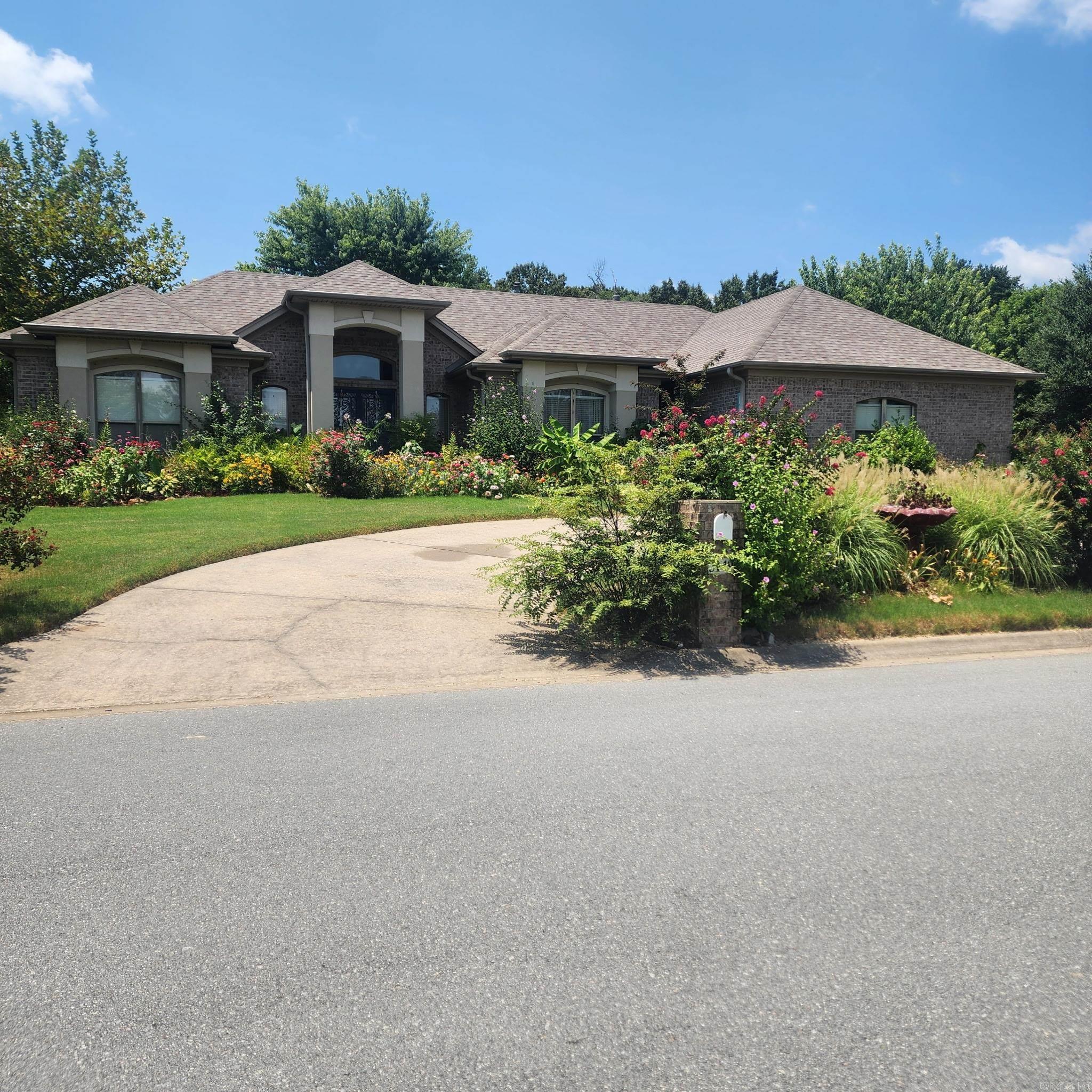 This custom built home with a circular driveway sits in a well established neighborhood on a corner lot in a Cul de sac with lots of landscaping and a beautiful fountain in the privacy fenced backyard. Covered back patio with a ceiling fan. The breakfast nook window overlooks the beautiful fountain. Split floorplan, Separate dining area, beautiful kitchen with granite countertops, Gas cooktop, electric double wall oven and dishwasher. Refrigerator conveys. Large primary bedroom has a tray ceiling and two walk in closets. Primary bathroom has two separate vanities, walk in shower, jetted tub and toilet closet. 2 car side load garage. Roof 2023. This home has been occupied by its original owner since it was constructed in 2004 and is in great condition. Schedule your private showing today.  See Agent Remarks.