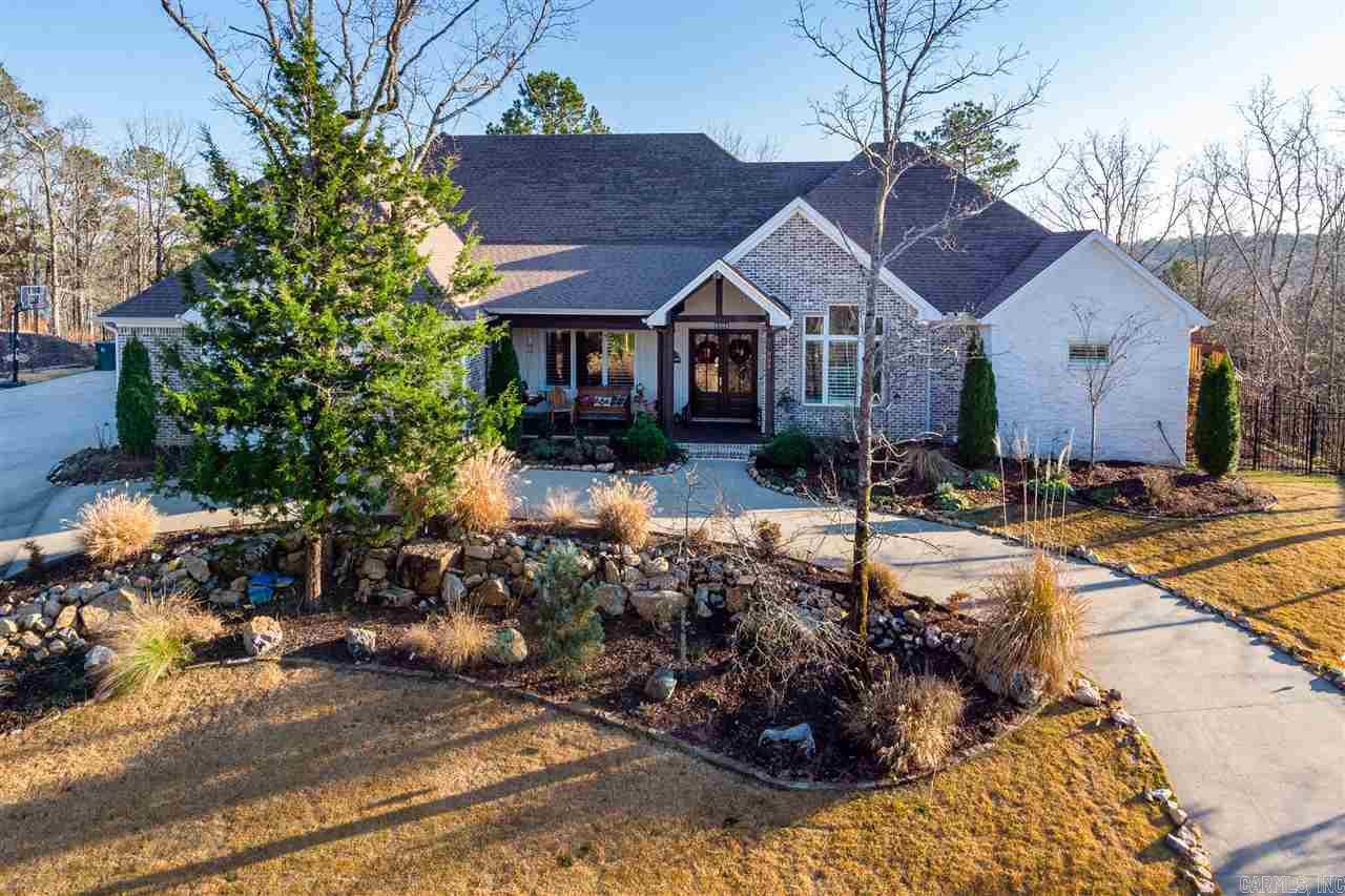 Spectacular hilltop home with great views! The ultimate floorplan for family living and entertaining. Three bedroom suites on main level with private bath. Office, bonus room and 20x20 multi purpose room with kitchen. Exercise, media room or nanny/in law quarters. 3 car side load garage with a circle drive. Greenspace surrounds home on the front and back with a lakeview. A must see!