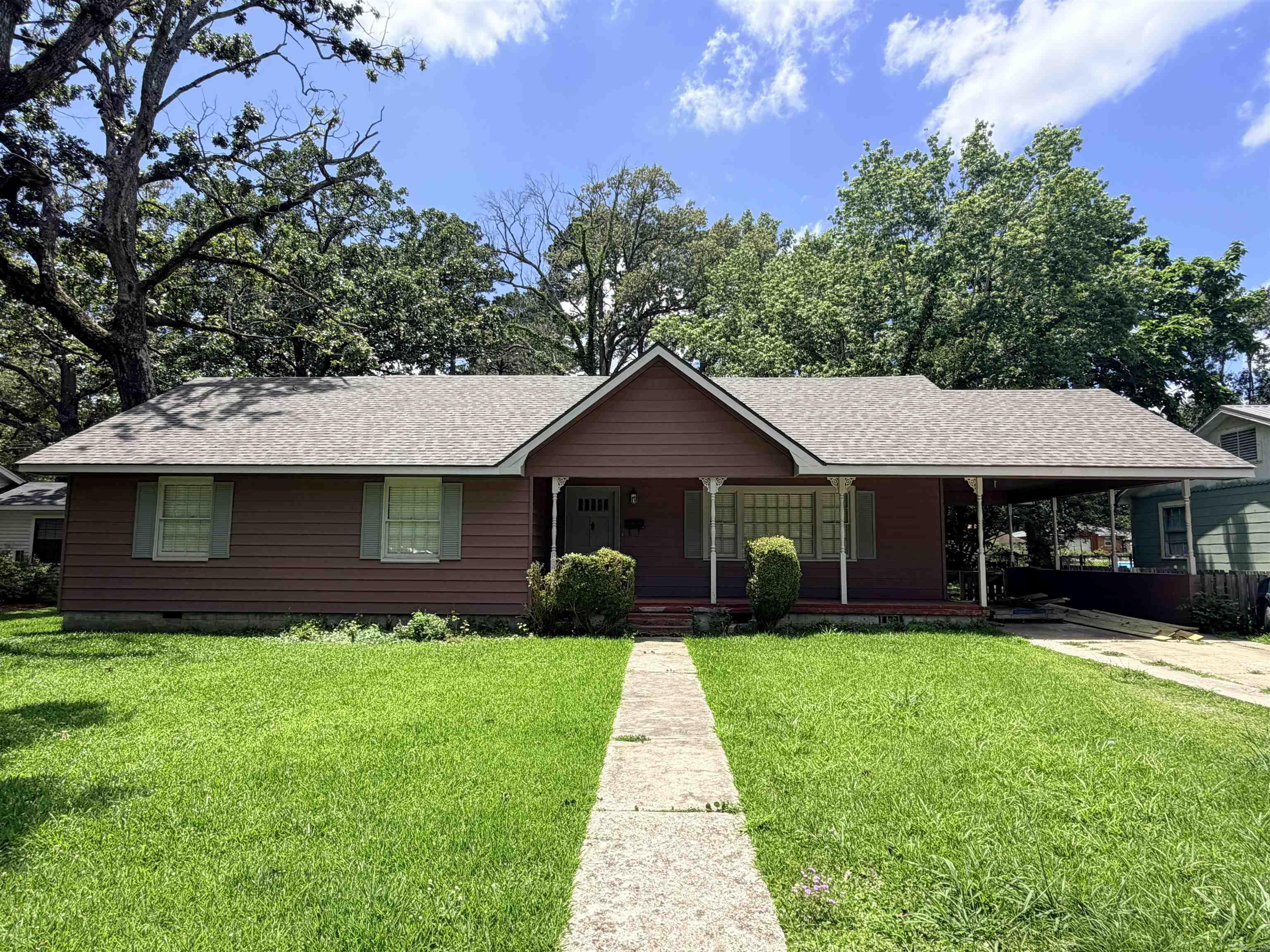 Newly updated & move-in ready 3BR/2BA, 1.5-story home with two living areas and upstairs bonus room. Neutral interior with new wood-laminate & ceramic tile flooring throughout and new interior & exterior paint throughout. Brand-new kitchen appliances remain. Both bathrooms have new shower/tub combos and vanities. Upstairs bonus room ideal for playroom, office, or 4th bedroom, with attic access to floored storage.  Additional features include: Architectural shingle roof (2026), new gas water heater, AC recently serviced, floor joists/subfloor replaced as needed. Large laundry room, walk-in closet in primary bedroom, bedroom built-ins and 22 x 26 ship on slab foundation.  Board & batten and sheetrock walls.  New wood deck is in the process of being installed!!