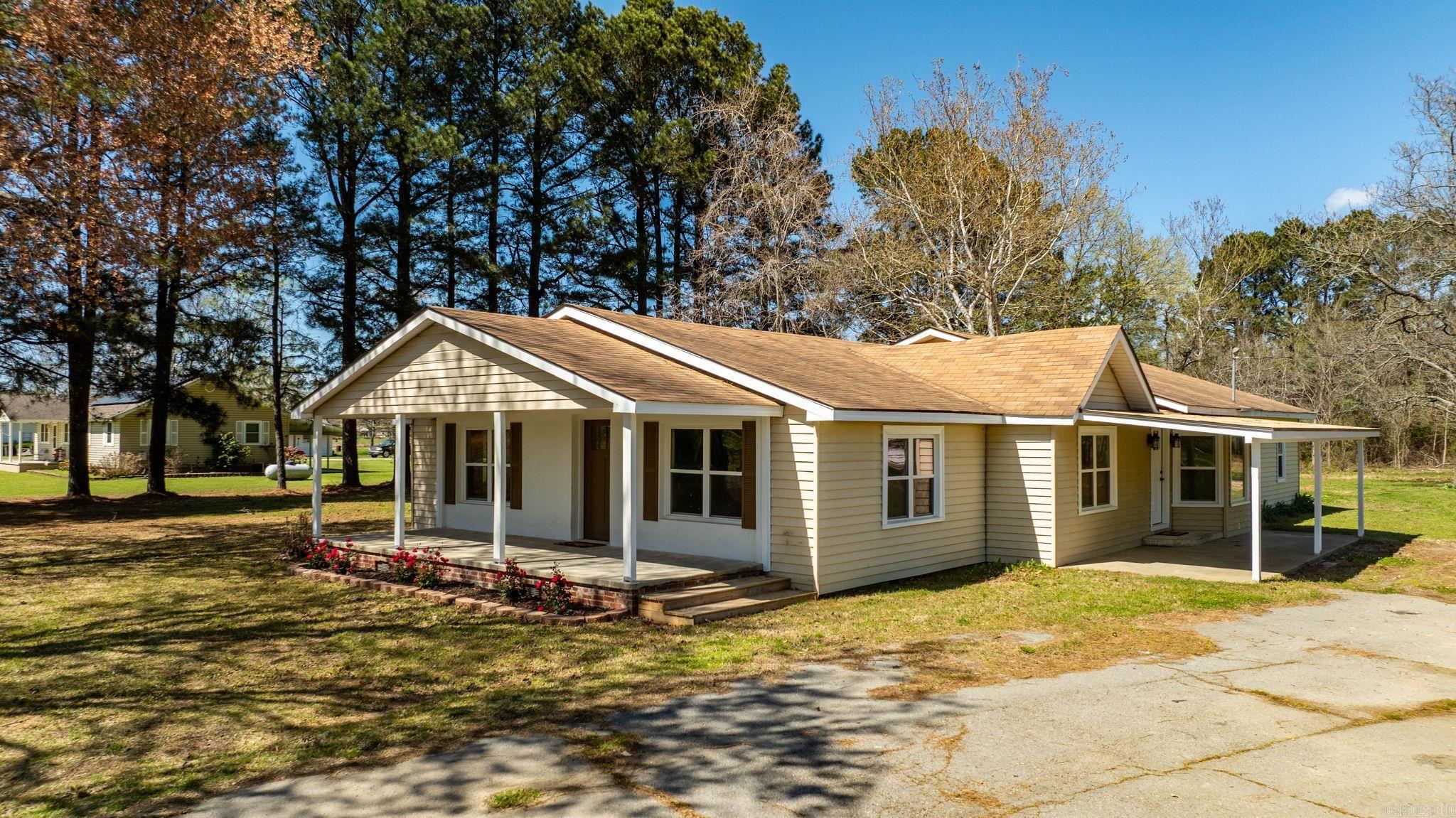 Completely remodeled home situated on nearly 2 acres, offering a like-new feel with modern updates throughout. This 4-bedroom, 3-bath home features a redesigned open floor plan with vaulted ceilings and abundant natural light. Recent improvements include new windows, HVAC system, hot water heater, sheetrock, paint, lighting, cabinetry, countertops, and appliances.  The spacious layout provides flexibility for a growing family or those needing additional room to spread out. The kitchen opens to the main living area, creating an ideal space for everyday living and entertaining.  Enjoy the peaceful setting from the front porch while taking in the surrounding nature. With extensive updates already completed, this home is move-in ready and offers the perfect combination of space, privacy, and modern finishes.
