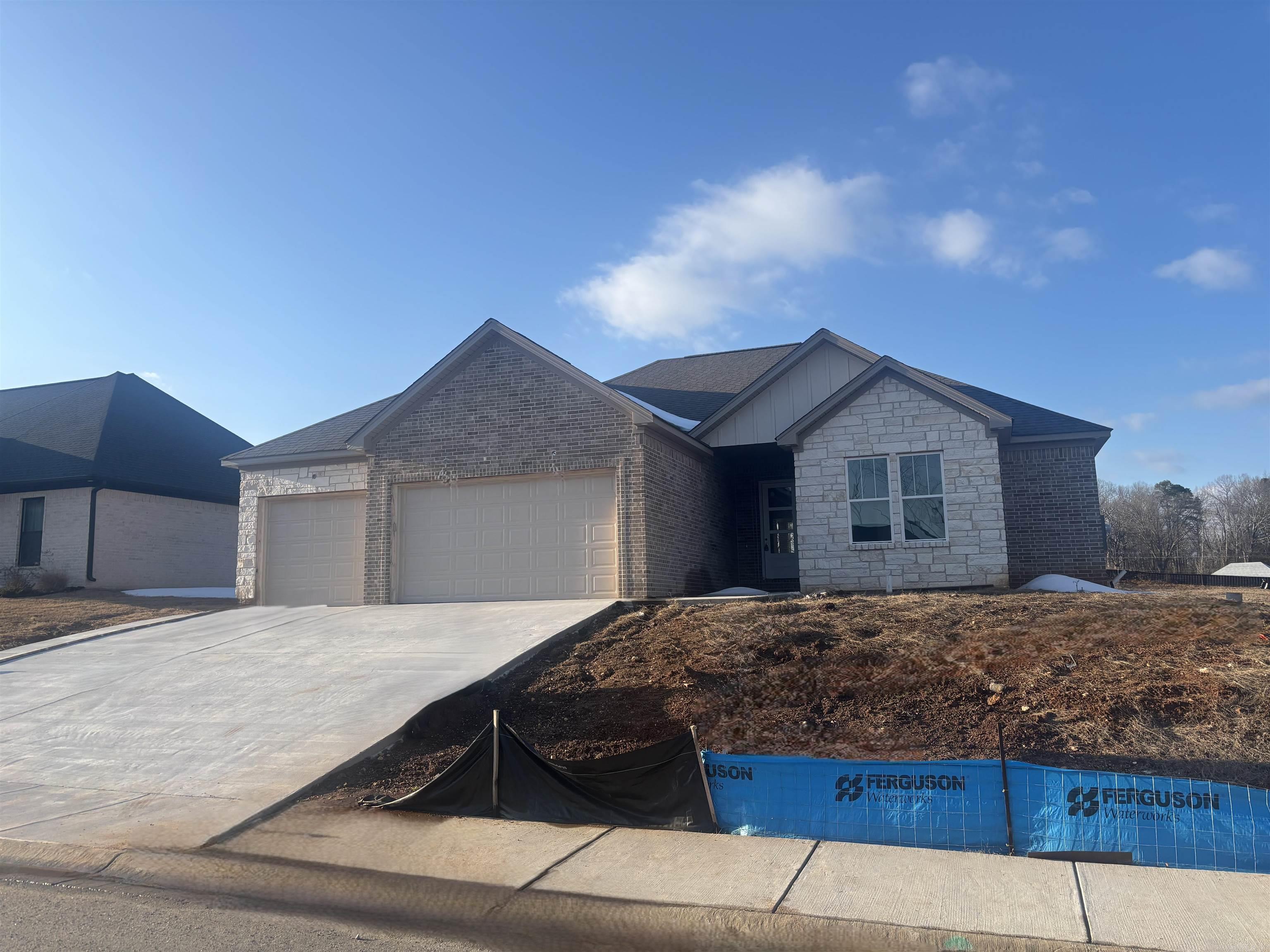 THREE CAR GARAGE!!! Large covered back porch, extra landscaping. LVP flooring , custom cabinets with large island, wall oven, gas cooktop. butler pantry, also regular pantry. Primary has tile shower with separate tub, large closet.