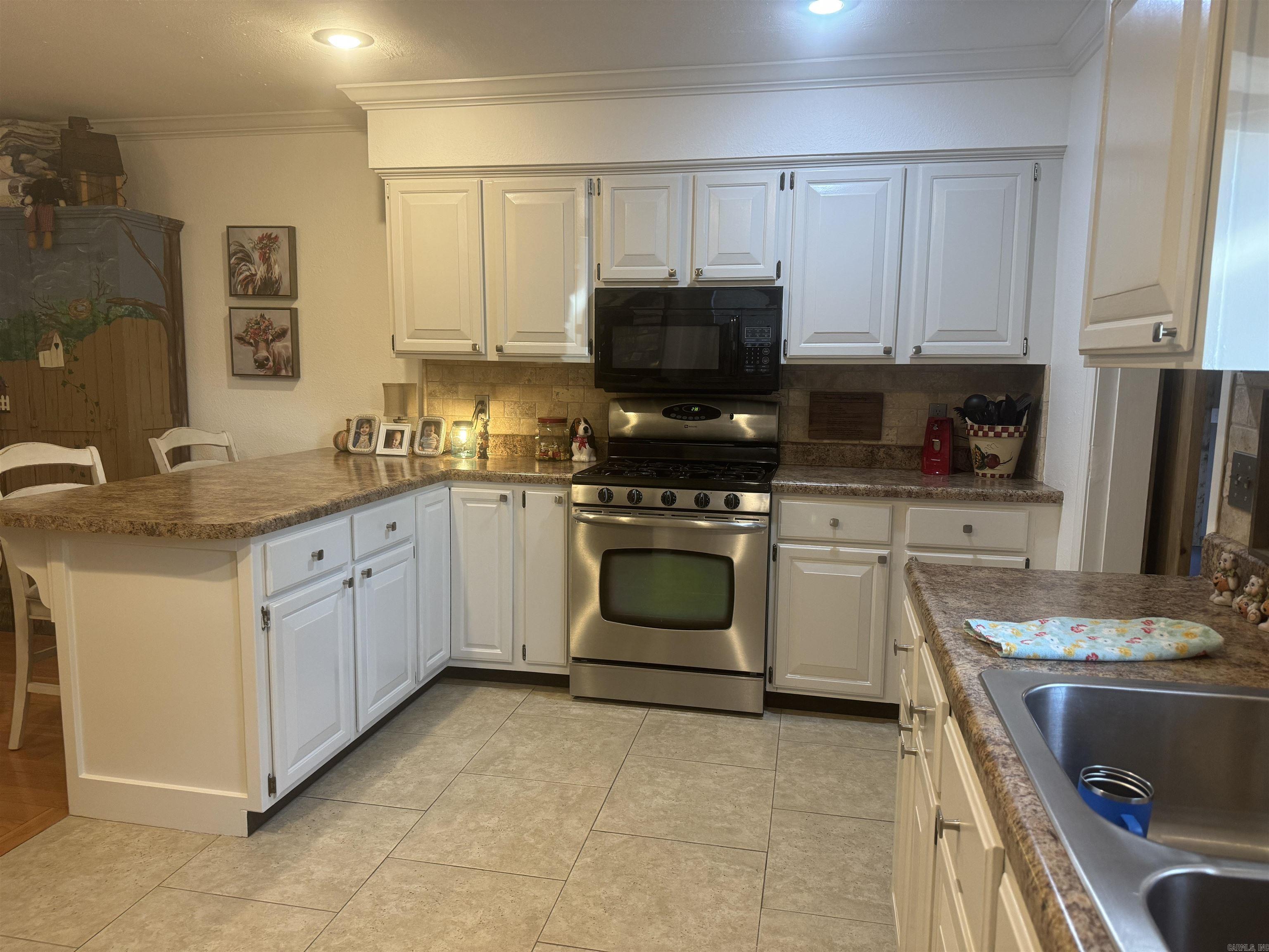 Maintenance free Brick home centrally located in Town om .24 AC M/L. Hardwood floors, Fresh paint, split bedroom plan. Two full baths. Fenced in backyard and privacy fence . 2 Car carport. Minisplit in converted garage. Whole house generator. Too cute to pass up. 1537SQ FT $199,900.