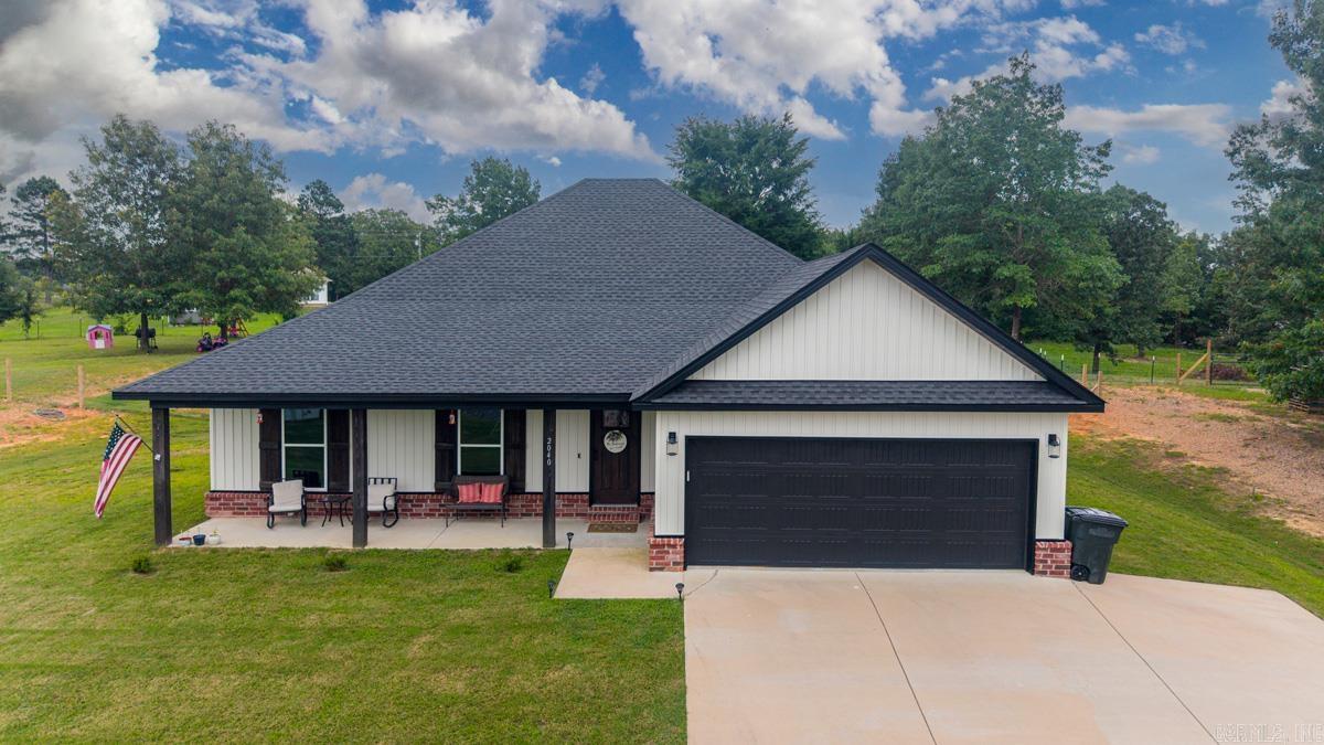 Beautiful home in Bauxite on 1.34 acres!! Featuring a large open floor plan with the kitchen overlooking both the living area w/wood burning fireplace, and the dining room! This single level home lives large and offers so many upgraded features! 3 bedrooms with the master on one side of home and 2 bedrooms opposite side of home. The kitchen has tons of cabinets and countertop space with ss appliances and a walk in pantry! Wood floors, tile, granite countertops, double vanity in master with separate tub and shower! No detail overlooked in this beauty! Huge 2-car garage and fenced yard! Covered back porch! This beauty is too good to miss! Schedule your showing today to see this gorgeous home before it's gone! **RD ELIGIBLE**