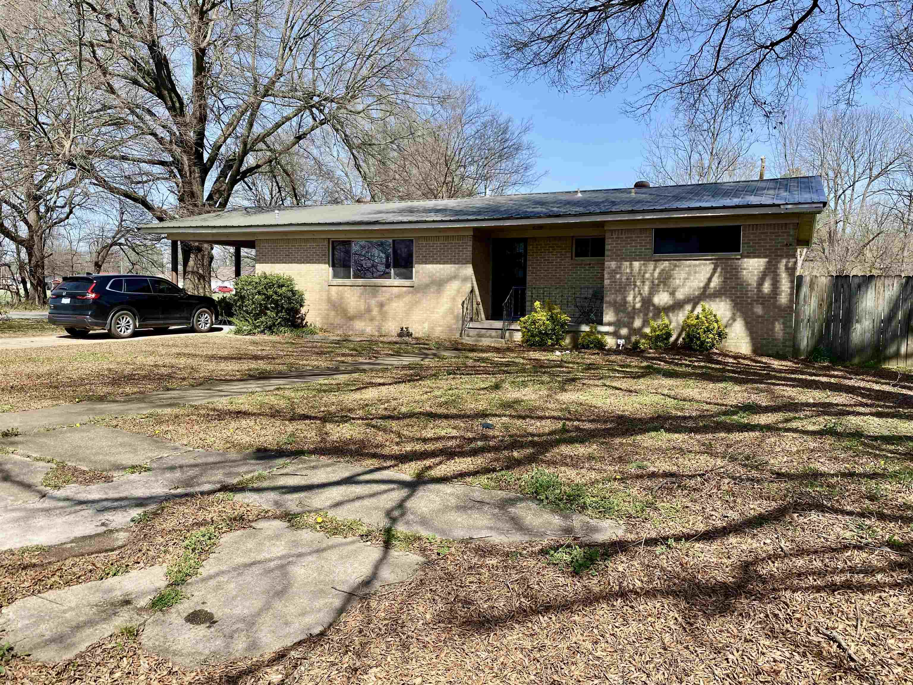3 bedroom 2 bath home offering 1,707 sq ft of comfortable living space on a spacious corner lot. Features a living and dining combo open to the kitchen, creating a functional layout for everyday living. Kitchen includes a convenient laundry area. Some windows have been updated for improved efficiency and natural light.   Master bathroom features a jacuzzi bathtub. Additional highlights include a large bonus family room, screened in back porch, and a large fully fenced backyard.  The property also includes a 24x24 shop building with a fenced in garage and attached screened in porch, ideal for storage, hobbies, or workspace.   Located approximately 25 minutes from Jonesboro and near Stewart Park and the Lawrence County School District.