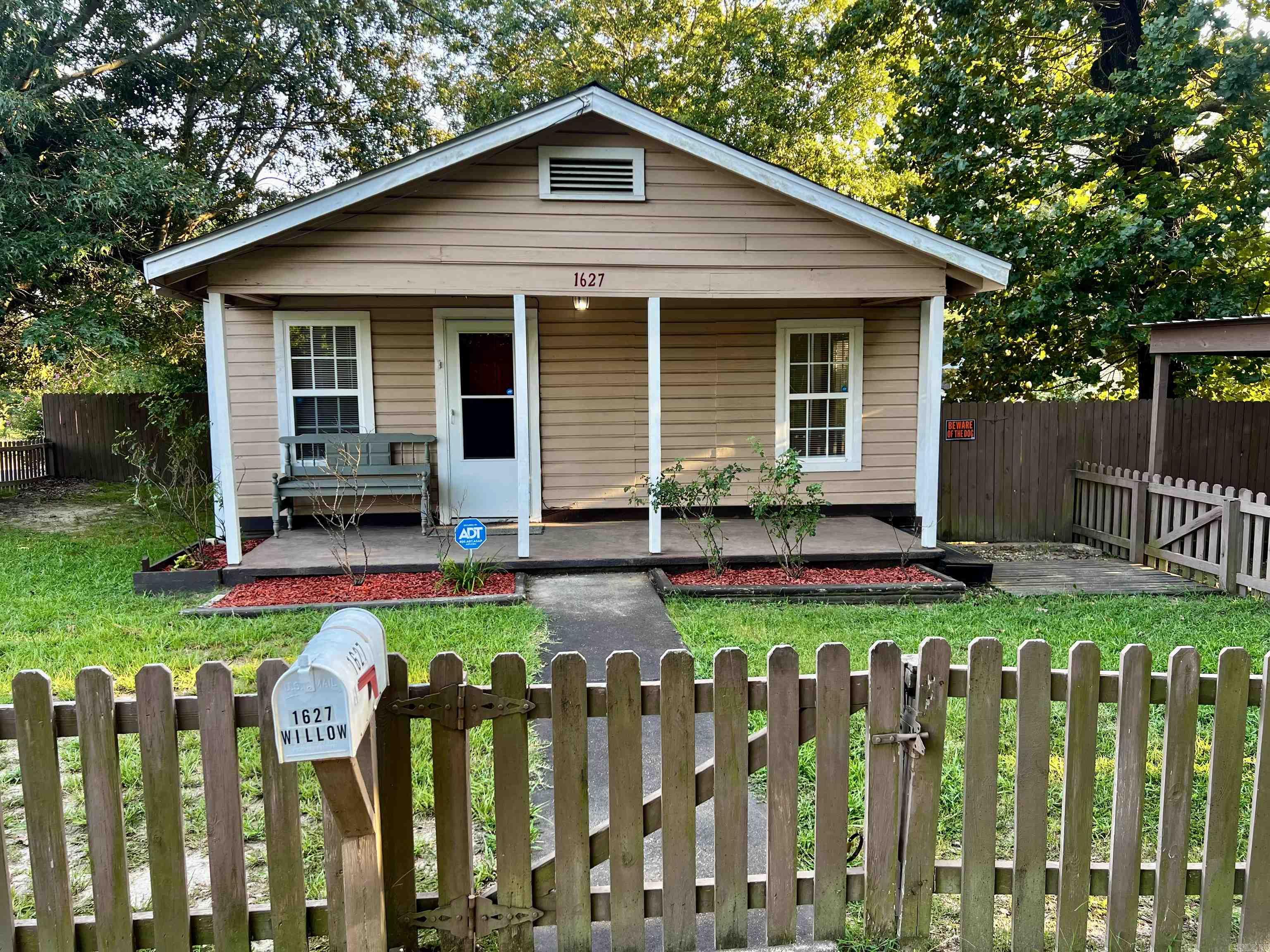 This cozy remodeled 3-bedroom 1-bathroom home is located on a corner lot in Malvern School District! This property features a back deck with a large fenced in backyard that has plenty of room for a garden. There is also 2 picnic tables and a large storage building included with the property. The property is approximately 960 sq. ft. and has a 1 car carport as well. In the kitchen there is a refrigerator, stove/oven, dishwasher, garbage disposal and lots of cabinet storage. There is also a washer and dryer and 3 window AC units.  All yard maintenance and utilities are the tenant's responsibility. The utilities are electric, gas, water, and trash. Pets allowed with deposit. The rent and security deposit are $1,200 each and the application fee is $35. You can apply for this property at www.mcgrawpropertymanagement.com/vacancies.