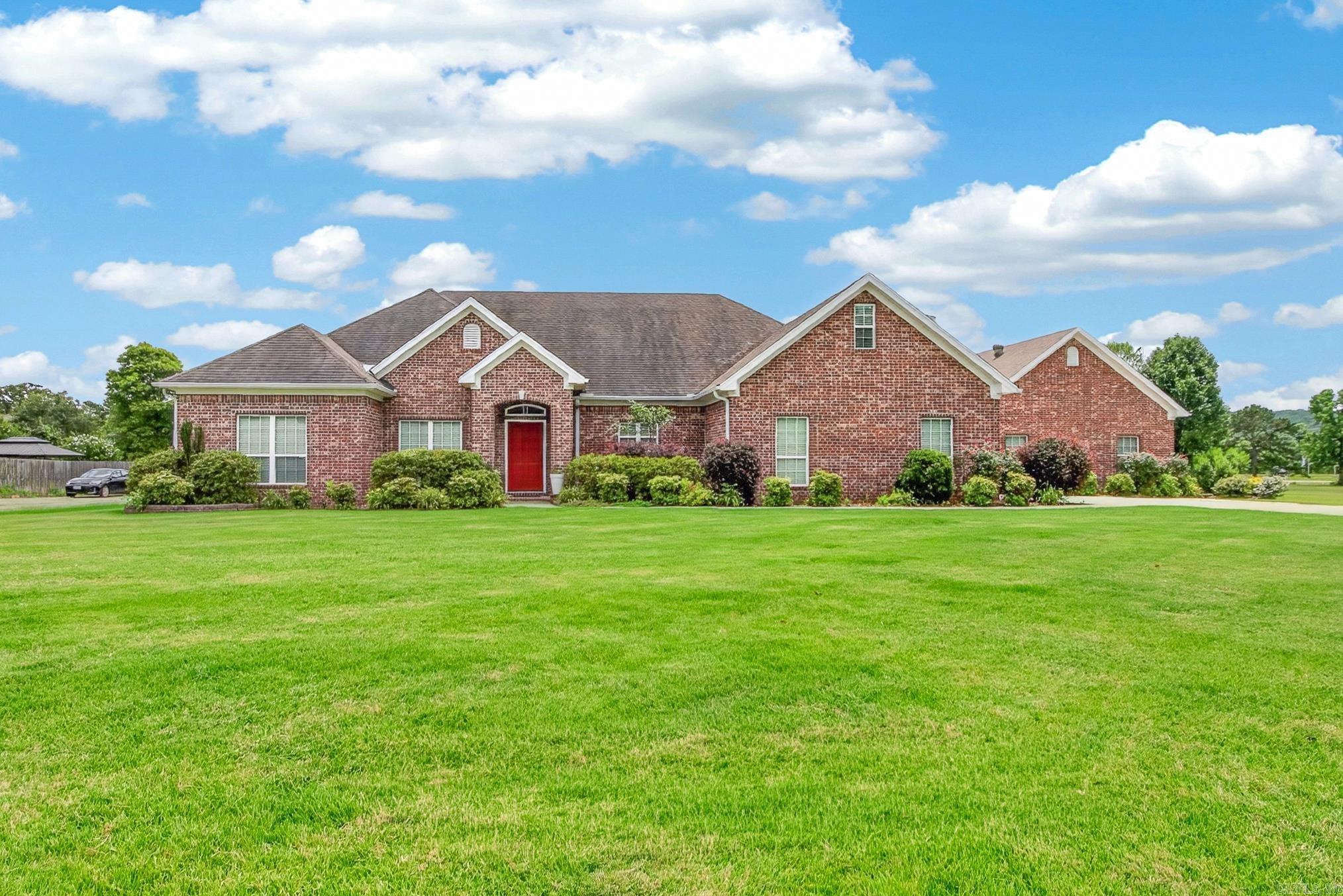 Welcome to this stunning 4-bedroom, 4.5-bath home in the sought-after Greystone subdivision, perfectly situated on the golf course. Each bedroom features its own private ensuite, offering comfort and privacy. The spacious floor plan welcomes you with a grand entryway, private office, and an impressive kitchen featuring abundant cabinet space, granite countertops, stainless steel appliances, a commercial-size refrigerator, pantry, breakfast bar, and dining area. The oversized laundry room includes built-in cabinets and a separate storage room. The spacious primary suite offers a double sink vanity, makeup vanity, and a tiled walk-in shower. Upstairs you'll find a large bonus room, an additional bedroom, and full bath. The heated and cooled third garage bay is perfect for a workshop or hobby space. Enjoy outdoor living with a covered back porch, inground pool with a diving board, dedicated outdoor pool bathroom, and beautiful golf course views. This home truly has it all!
