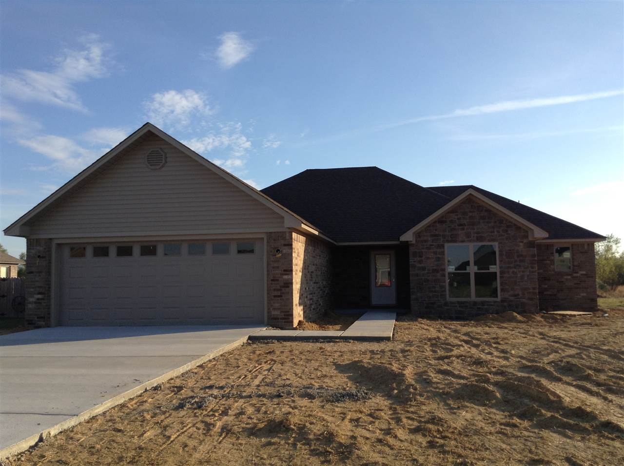 Hurry to see this brick and stone new construction home. It features a safe room in the master bathroom closet. Tiled back splash with granite countertops in kitchen. Hardwood laminate in living room and hallway. Nice separate laundry room. Covered back porch.
