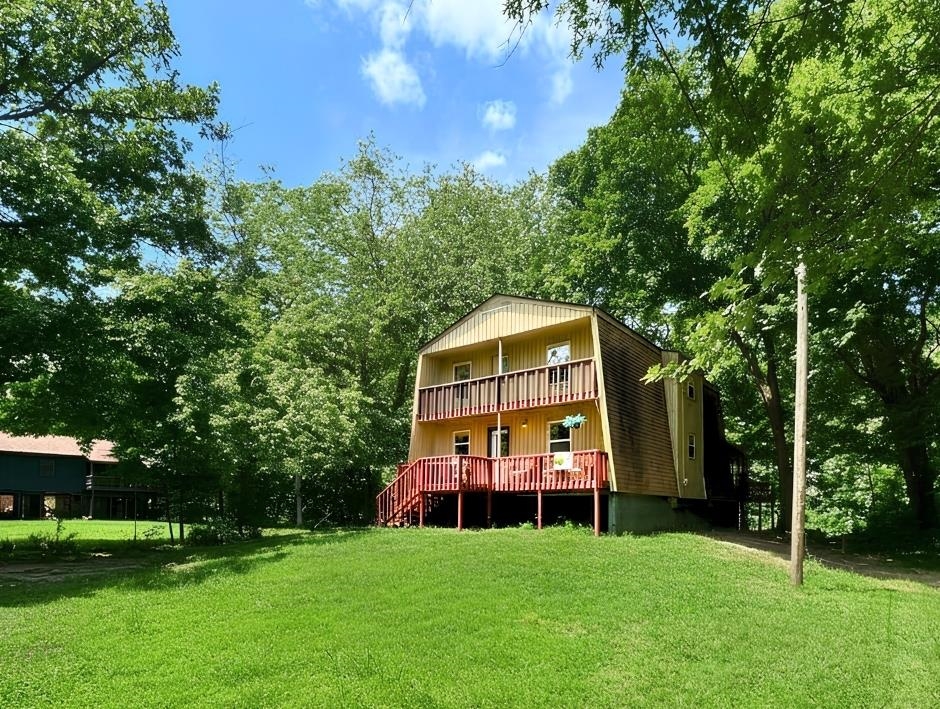SOUTHFORK RIVER HOME! Remodeled and updated, this waterfront retreat offers 60 feet of tranquil South Fork frontage perfect for swimming, floating, and kayaking, with 1,668 sq. ft. of inviting living space across two levels plus a full unfinished basement ideal for storage or future expansion. The Arkansas room delivers calming wraparound views and opens to a spacious back deck suited for summer BBQs, morning coffee, and peaceful evenings by the water. The main level features a welcoming 14x22 living room with a natural stone wood burning fireplace, an open kitchen and dining area, sunroom, primary bedroom, and full bath, while the second level includes two additional bedrooms, another full bath, and a versatile loft. Recent updates include new luxury vinyl flooring throughout the main level and brand new stainless steel kitchen appliances—stove, microwave, refrigerator, and dishwasher—making this riverfront oasis move in ready.