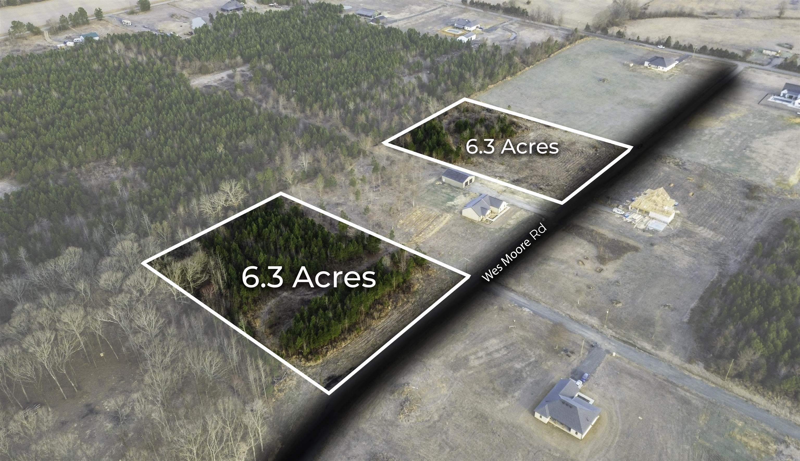 Beautiful flat 6.30+/- acre lot right outside of city limits, perfect spot if you are looking to build! Gorgeous new construction houses are going in all around. Enjoy great views of the countryside in a quiet area while only being a few minutes from the interstate. 20 mins to Vilonia, 20 mins to Searcy, & 20 mins to Cabot. Water and electric are available at the road. No mobile homes. Minimum square footage of 1700.