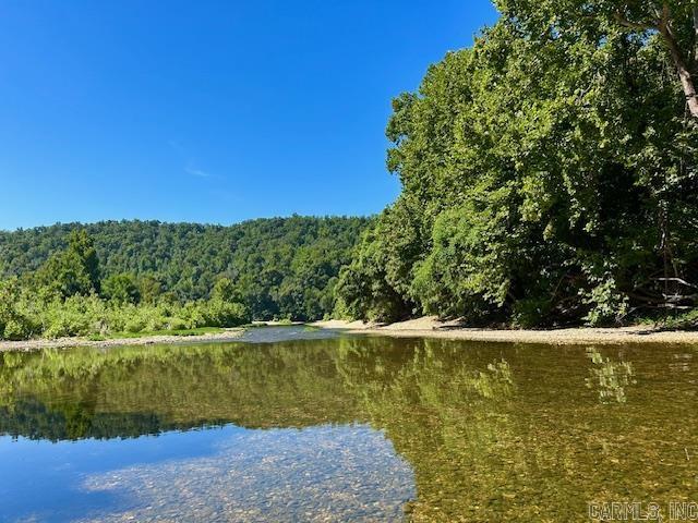 Welcome to your private slice of paradise. This breathtaking 40-acre property offers rare SYLAMORE CREEK FRONTAGE. With over 300 ft of Creek frontage and crystal clear, year round water, perfect for fishing, Kayaking, and just simply hanging out and enjoying. Nestled just a short distance from Mountain View and the beautiful White River. Float to the White River even. This land has stunning views and great building spots as well. Whether you are dreaming of a secluded getaway, a family retreat, or a forever home surrounded by natural beauty, this property checks all the boxes. Enjoy the sounds of the creek and those beautiful views forever. Don't miss this rare opportunity to own a piece of sylamore creek paradise. Seller is willing to put electric on the South East corner of property. Seller also has 5 more acres with Creek frontage and power see MLS#260003976