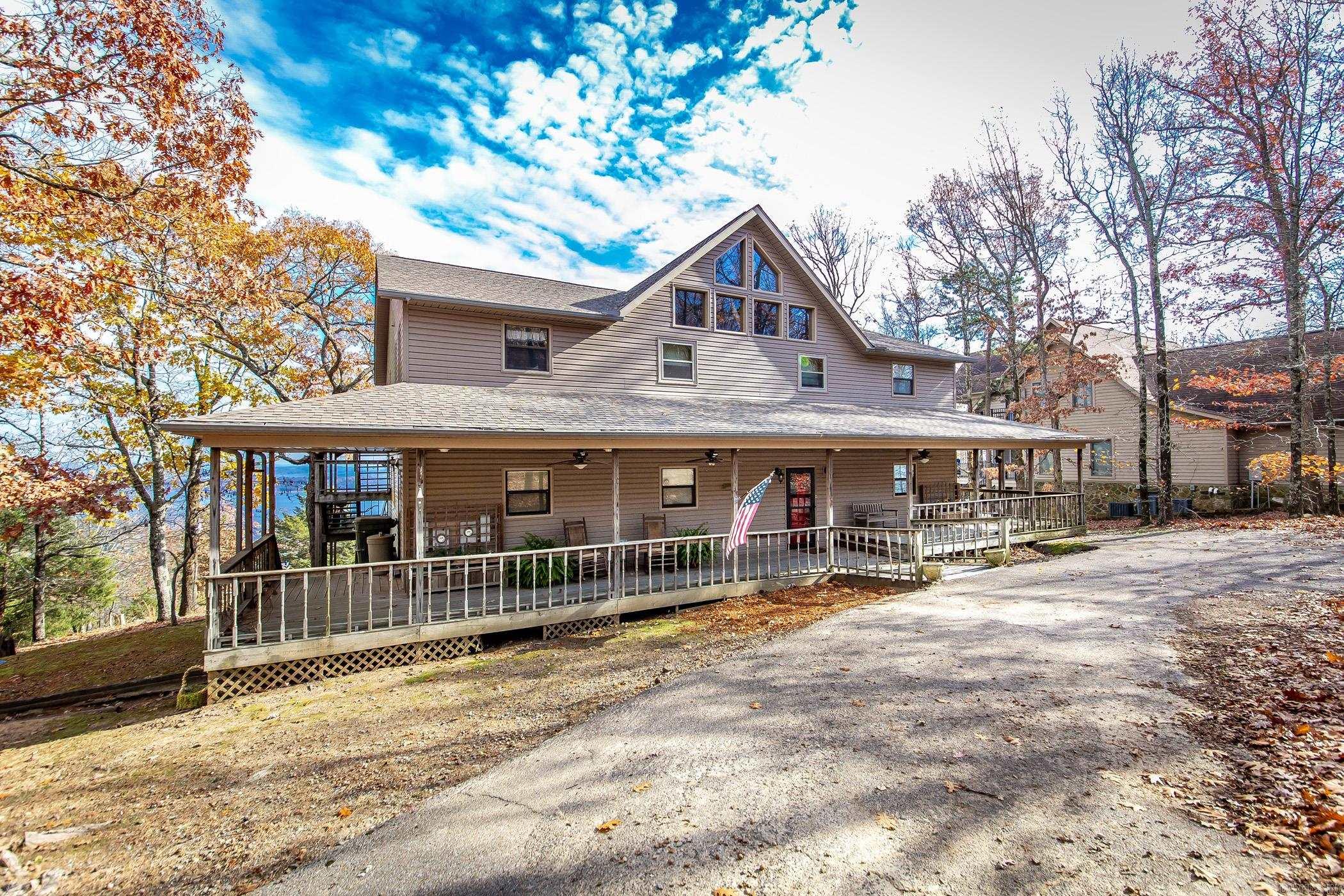 The BEST view on the Lake!  2 brand new decks just completed!  This Diamond Bluff home has had only one owner and is perfect for any large family or lots of friends.  Roof replaced 2020.  It has 2 completely separate living spaces. Various updates have been made to both. The approx. square footage is 2000 upstairs and 2000 downstairs. A total of 6 bedrooms, including a master upstairs and downstairs.  4 bathrooms with 2 upstairs and 2 down.  Kitchen, laundry room, and nice living rooms upstairs and downstairs.  It is truly a must see!