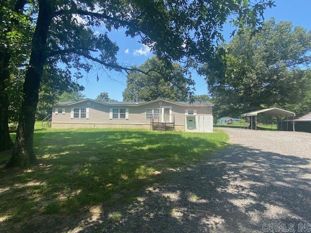 Stunning mountain views and open pastureland sets the scene for this beautiful little farm/ranch. Over 120 luscious acres with 6 ponds, loaded with fish, creates the perfect place for animals of any kind and lots of barns and storage room. Hay fields could possibly create a little revenue. This 3 bedroom, 2 1/2 bath manufactured home has over 2,000 square feet with large porch across the back to sit and enjoy the views. New E4 storm shelter has been installed, 2 wells on the property, with a whole home generator that is run on propane.