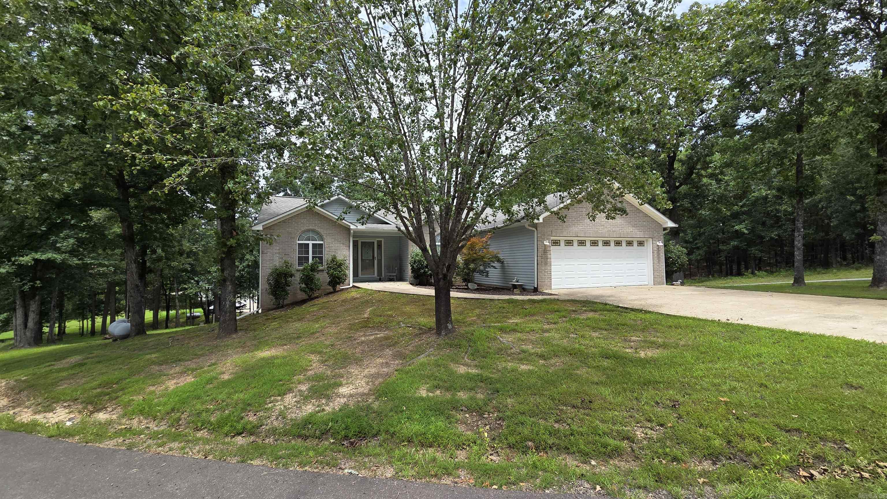 Welcome to market this well-maintained family home offering over 3,300 square feet of living space, just a short walk from Greers Ferry Lake, Devils Fork Boat Ramp, and the nearby campground. This spacious home features 4 bedrooms, 3 bathrooms, an open-concept floor plan, two kitchens, two laundry rooms, a large walk-in shower, a cozy wood-burning fireplace, and propane backup heat for added peace of mind not to mention its all been freshly painted in past 3 years. The finished lower level provides endless possibilities—perfect for a large or multi-generational family, a game room, guest quarters, or entertaining. You'll also appreciate the walk-in storm shelter and abundant storage space, making it ideal for those needing extra room or preparing for emergencies. Enjoy all the benefits of lake-area living without paying lakefront prices. Whether you're looking for a full-time residence, vacation home, or investment property, this home offers space, comfort, and an unbeatable location near one of Arkansas's most popular recreation area Devils Fork Campground and fishing tournament spot. Come and see for yourself today