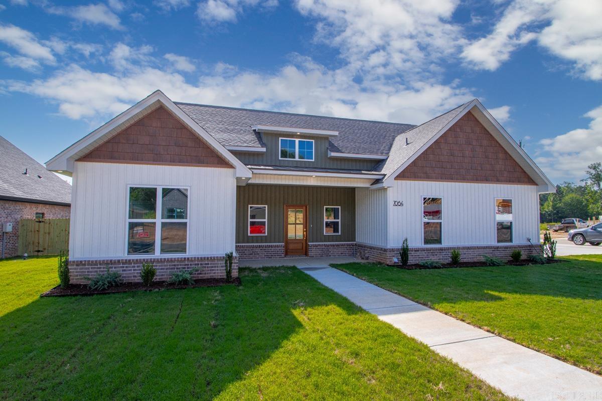 This brand-new, move-in ready home sits on a corner lot in a sought-after neighborhood, offering the modern craftsman style that stands out from the rest. Vaulted ceilings, custom trim, and accent walls set the tone throughout 2,154 square feet of thoughtfully designed living space. Large windows fill the living areas with natural light, creating a bright, airy feel from room to room. The kitchen anchors the open floor plan with beautiful cabinetry and a gas range, flowing seamlessly into a living room featuring a gas fireplace and vaulted ceiling. The split floor plan offers privacy, with a spacious primary suite you'll love and a conveniently located half bath that makes hosting easy. Outside, enjoy a covered back patio, a spacious yard, and a side-entry two-car garage.