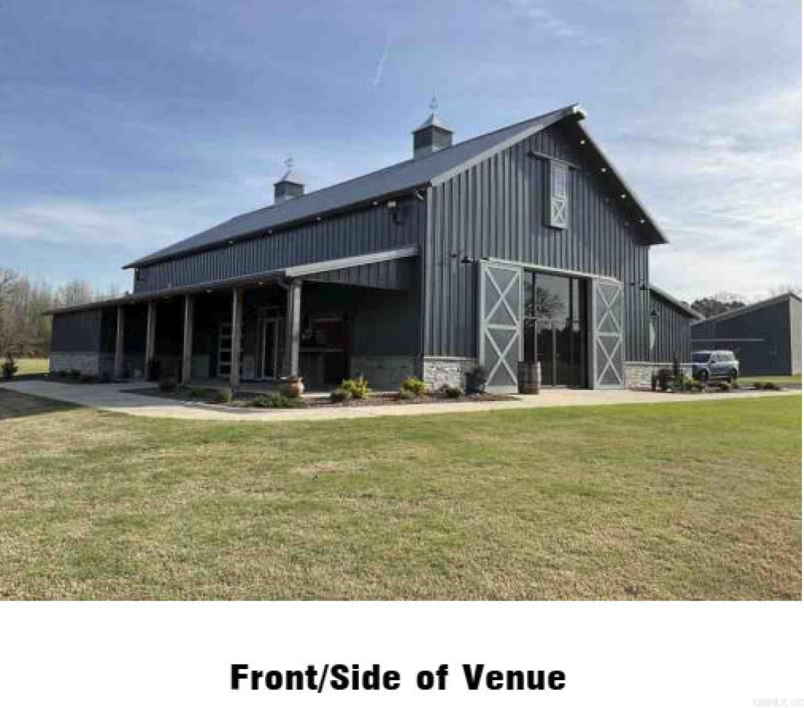 Offers requested. Income opportunity.   Welcome to Francis Farms, a distinctive 73± acre estate near Jacksonville, AR, offering a turnkey venue, multi-residential potential, and room to expand into equestrian, agricultural, or recreational ventures. The centerpiece is a 4,808 SF two-level venue barn with bride’s and groom’s quarters and a full industrial kitchen. Nearby, an open-air pavilion provides a scenic space for ceremonies and seasonal events. Additional structures include: • 270 SF cabin for overnight stays or prep • 2,400 SF party barn with bar, kitchen, golf simulator, and TVs • 2,400 SF block shop/storage building • 812 SF storage building with overhead door • 280 SF pavilion for casual gatherings or vendor setups The land features open pasture, 43± wooded acres, and a scenic pond. Whether you envision a horse farm, pumpkin patch, or private retreat, the layout supports diverse uses. Sale includes all furniture, fixtures, and equipment: • 2 zero-turn mowers • 2 four-wheelers • John Deere tractor with rotary cutter and loader Sellers will continue booking events until closing. All booked events must be honored, with fulfillment terms negotiable.