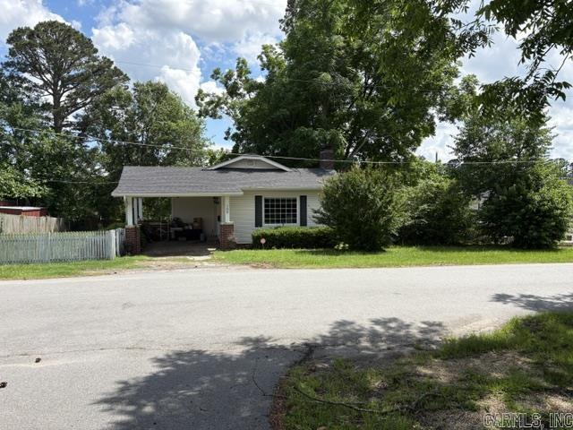 Older home in original part of Sheridan, one block south of Grant County Courthouse on Holly Street.  The home has been partly destroyed by a storm  two different times and completely renovated.  Single carport attached to home.              New central heat & air with carpet and wood subfloors.