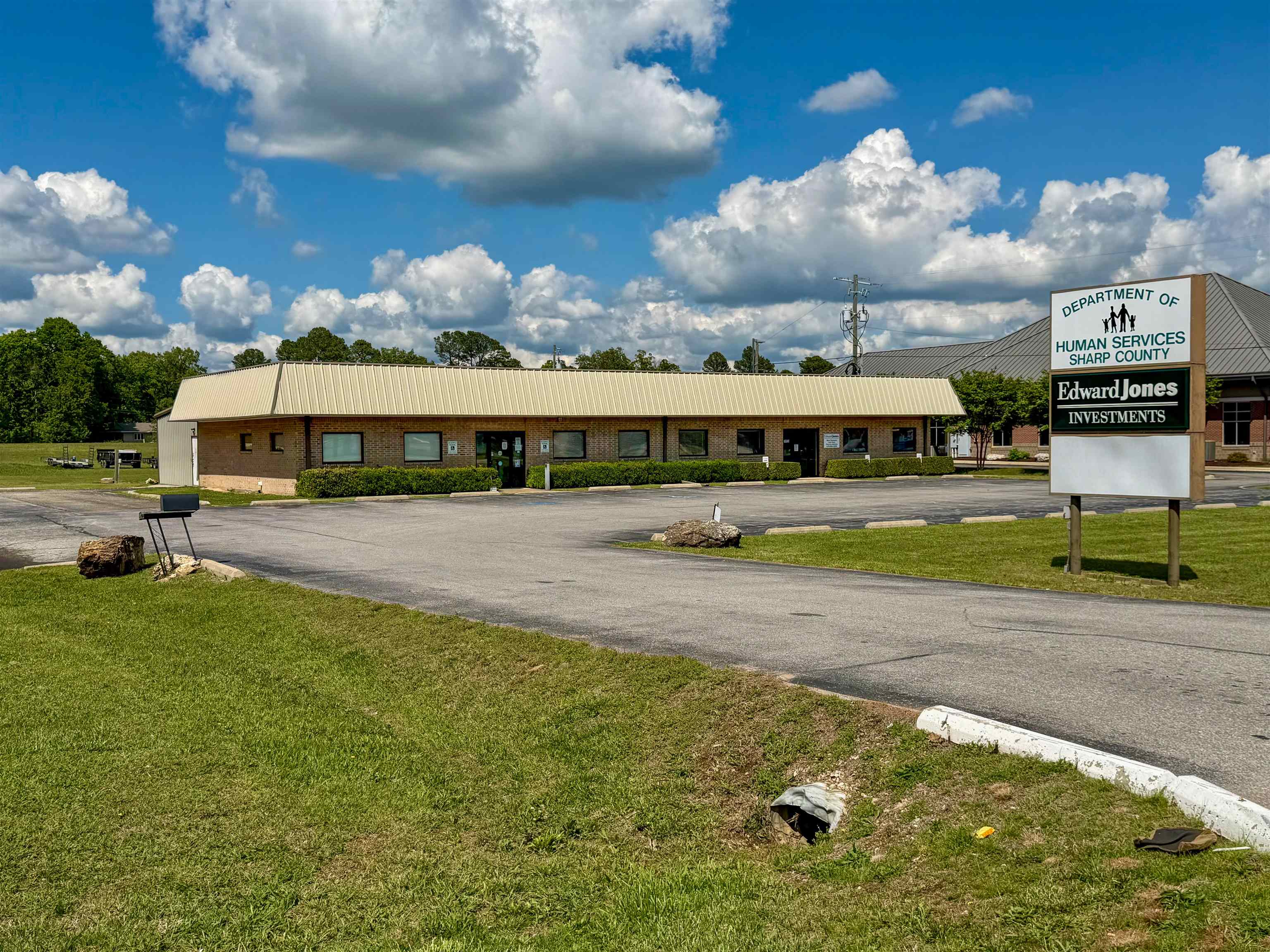Prime Commercial Investment Opportunity with Guaranteed Income Streams! Strategically situated at a high-visibility, traffic-light-controlled major intersection, this premier 6,500-square-foot commercial building offers unparalleled exposure. Perfectly positioned next to high-traffic anchors like Casey’s Gas Station and major local banks, the property features a robust structure originally built in 1996, seamlessly expanded with a 2,500-square-foot addition in 2003. Investors will appreciate the immediate, reliable cash flow provided by two secure tenants: a stable 2-year government lease occupies one side of the building, while a highly desirable, rolling 5-year lease secures the other. Fully equipped with reliable city water and city sewer infrastructure, the property also boasts an expansive paved lot with 49 dedicated parking spots to easily accommodate staff and a high volume of clientele. Don't miss out on this turnkey, low-risk addition to your commercial portfolio in a booming retail and professional corridor!