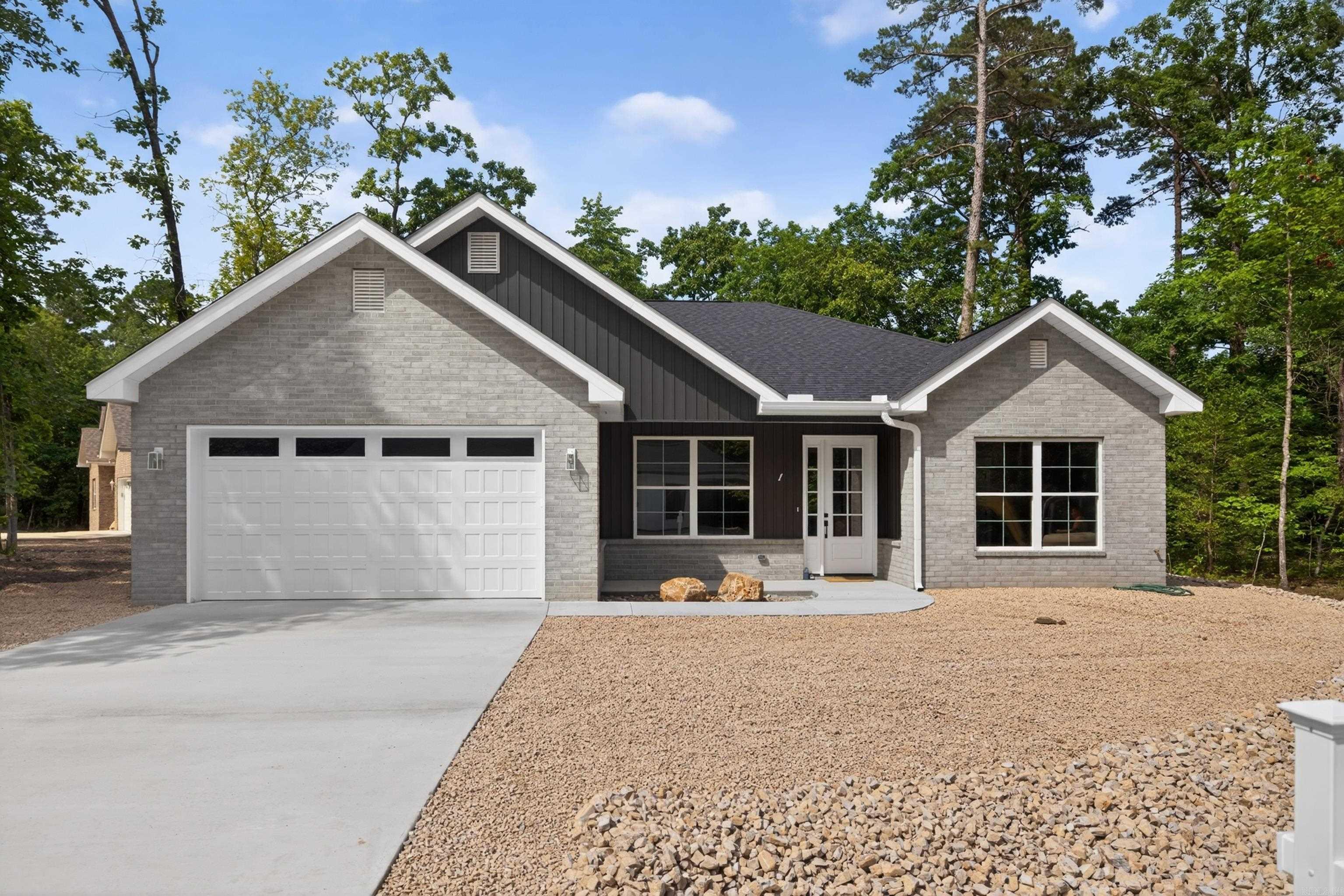 New Construction energy-efficient home on a quiet cul de sac, featuring 10' ceiling, an open concept layout, and a spacious living area around a sleek electric fireplace. Kitchen offers quartz countertops,  Fridgidaire professional appliances, custom shaker cabinets, tile backsplash, large island, and matte black finishes. Spacious primary suite with oversized walk-in shower, dual vanities, lighted defrost mirrors, and walk in closet. Additional highlights include mudroom with built-in bench, laundry room with sink and cabinetry, energy efficient HVAC, 50- gallon quick recovery water hearer, and low-E windows. The striking brick exterior, covered porch, and attention to detail throughout make this home a must-see/ Enjoy the covered patio, perfect for nature watching and relaxing in a peaceful setting. One year builder warranty included. Taxes reflect lot only.