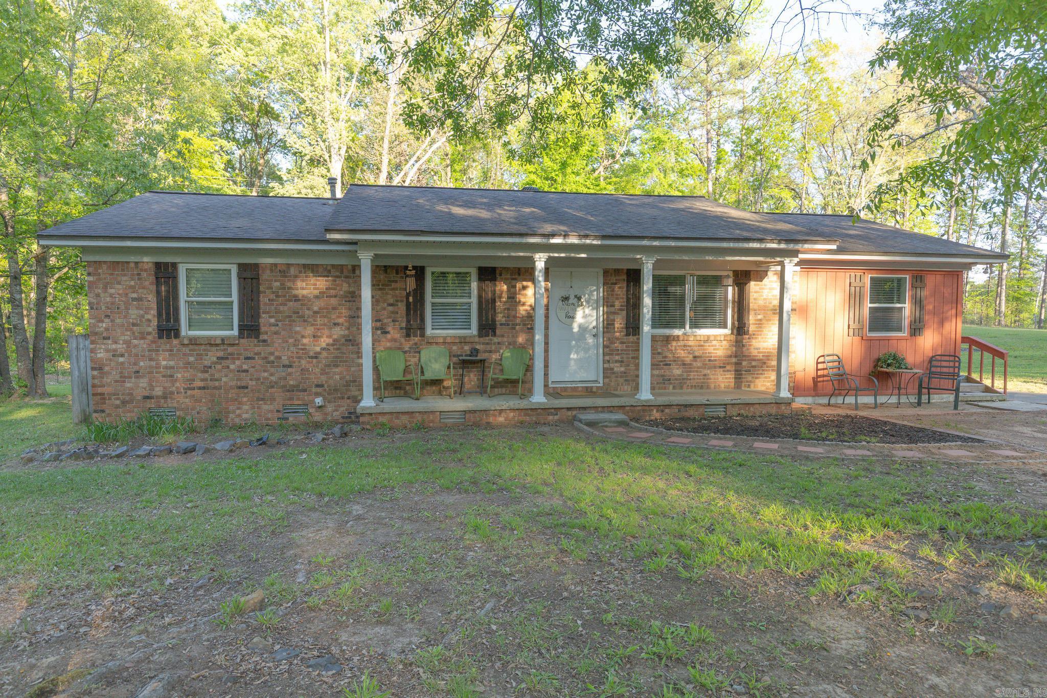 Welcome to this beautifully updated 3-bedroom, 2-bath home offering the perfect blend of comfort, functionality, and space—all situated on 1.24 acres in a convenient location! Seller completely remodeled this home for you! Inside, you’ll find a nicely remodeled kitchen featuring added cabinetry for extra storage, along with updated finishes that make this space both stylish and practical. The home has some original hardwoods in the bedroom and luxury vinyl plank throughout the rest of the home. The oversized laundry room adds even more convenience and functionality. The spacious primary suite includes a walk-in shower. Major updates have already been taken care of, including a 9-year-old roof, HVAC system, and newer easy-clean windows. Step outside and enjoy the large back deck—perfect for entertaining or unwinding while overlooking your acreage. The property also features a 30x36 red iron shop with three bay doors, insulation, electricity, and a concrete floor—ideal for hobbies, storage, or a workspace. Both city sewer and an additional septic system. Call for property line details-OnX is incorrect.  Don’t miss your chance to own a move-in ready home with space to spread out.