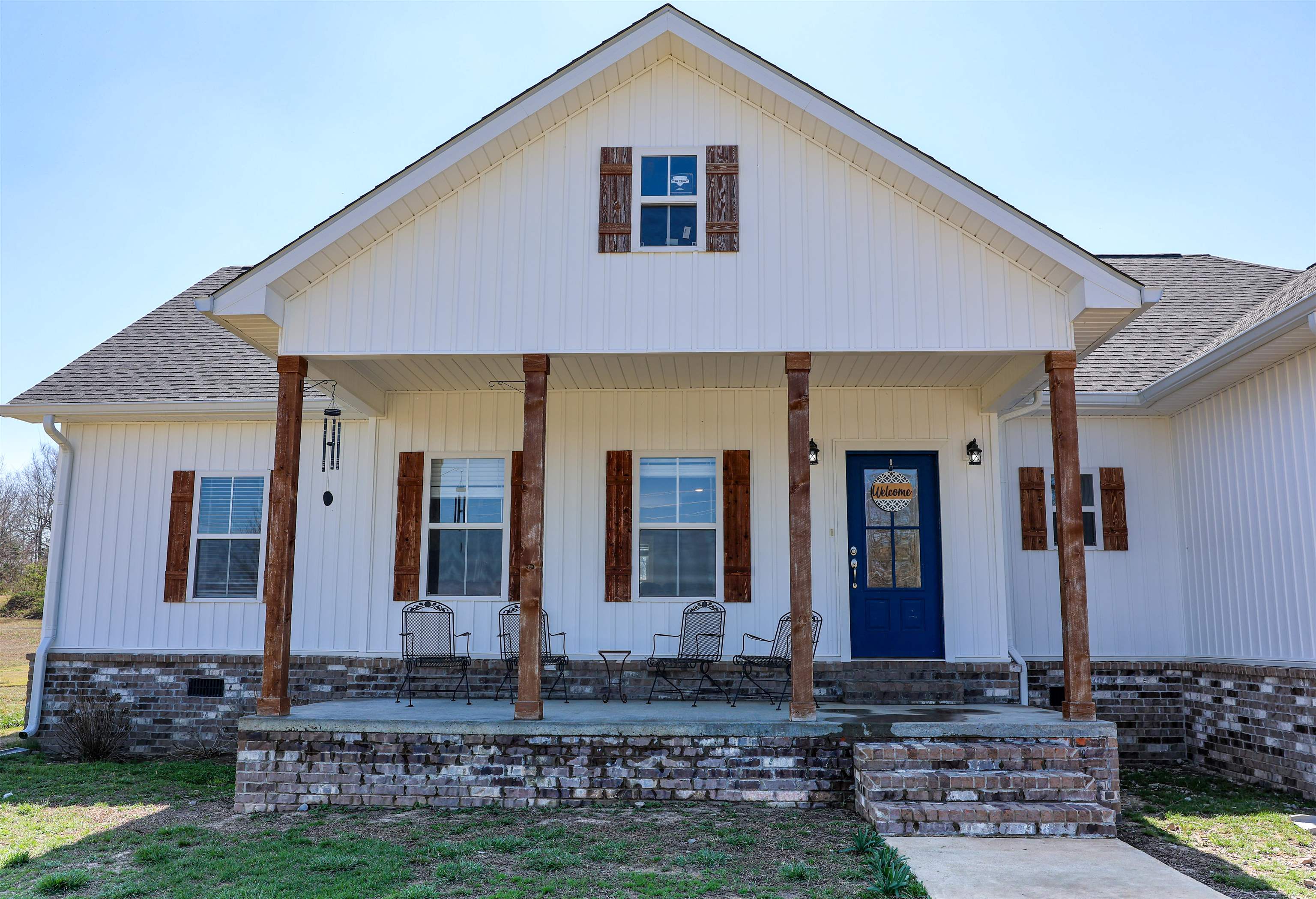 Modern Farmhouse Charm in Sage, Arkansas Escape to the quiet countryside with this stunning 2020-built modern farmhouse, perfectly situated to offer both privacy and convenience. This home captures the eye with its crisp white siding, charming shutters, and a welcoming covered front porch made for morning coffee. Inside, the spacious open-concept living area is anchored by a cozy gas log fireplace, ideal for those nippy Arkansas winters. The heart of the home is a chef-inspired kitchen featuring a striking butcher block island and breakfast bar—the perfect hub for everything from quick weekday meals to festive weekend brunches. The primary suite features a massive ensuite bathroom designed for ultimate relaxation. It features elegant double granite vanities, a sleek walk-in shower, and a freestanding soaking tub for luxurious evenings. Storage is a breeze with a generous walk-in closet and an oversized two-car garage. Located just minutes from local schools, medical clinics, grocery stores, and a top-tier public golf course, this property offers the serenity of rural living without sacrificing modern amenities. Your dream of a peaceful, high-end lifestyle starts right here!