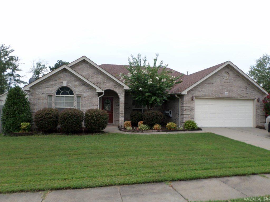 Well kept home is ready for your family! Large living area w/tray ceilings, gas FP, & has beautiful hand scraped hardwood floor. Eat-in kitchen has granite counter tops. Refrigerator stays. Master BR w/hand scraped hardwood floor, tray ceiling & large walk in closet.  Master bath has separate shower, whirlpool tub, & TWO more closets! Two nice sized secondary bedrooms. The covered back porch has a large extended concrete patio. Beautiful landscaping front & back. Underground storm shelter in garage.