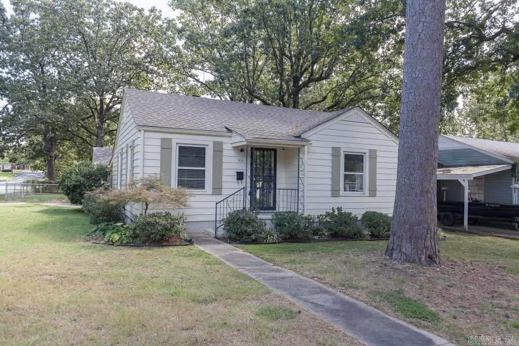Adorable home on large corner lot in heart of Hillcrest! Updated throughout with refinished hardwoods, kitchen with custom cabinets, tile countertops, subway tile backsplash, tile flooring and gas stove. Bathroom has new vanity, tile surrounding tub and flooring. One car carport and large storage shed.