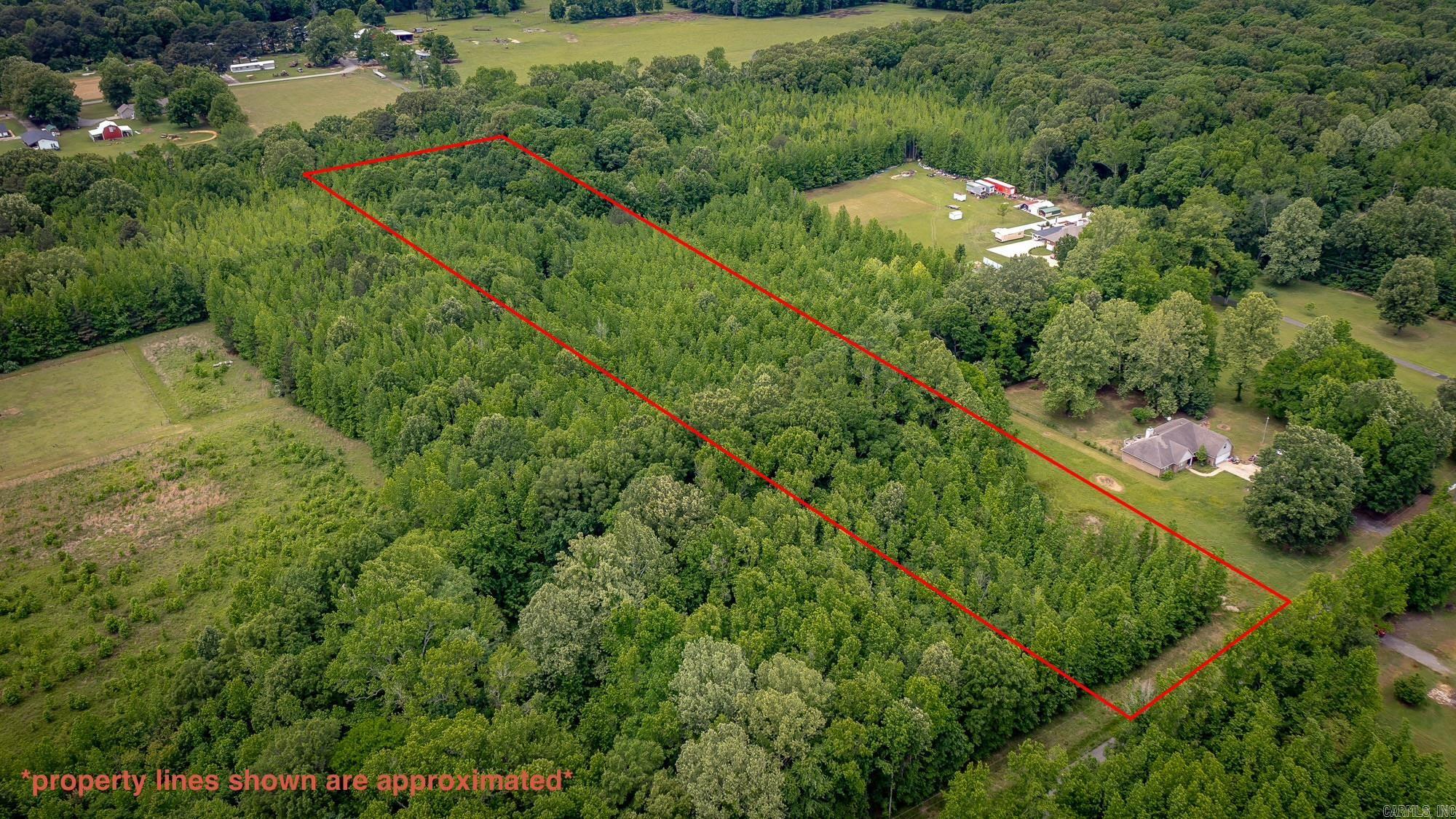 Discover the perfect opportunity to build your dream home on this beautiful 5-acre tract located on Oak Grove Rd in Austin. This raw land offers a blank canvas with water and electricity available at the road, making it ready for your vision to come to life. Enjoy the peace and privacy of country living.  BOA on file. 1800 sq ft minimum. No mobiles allowed.