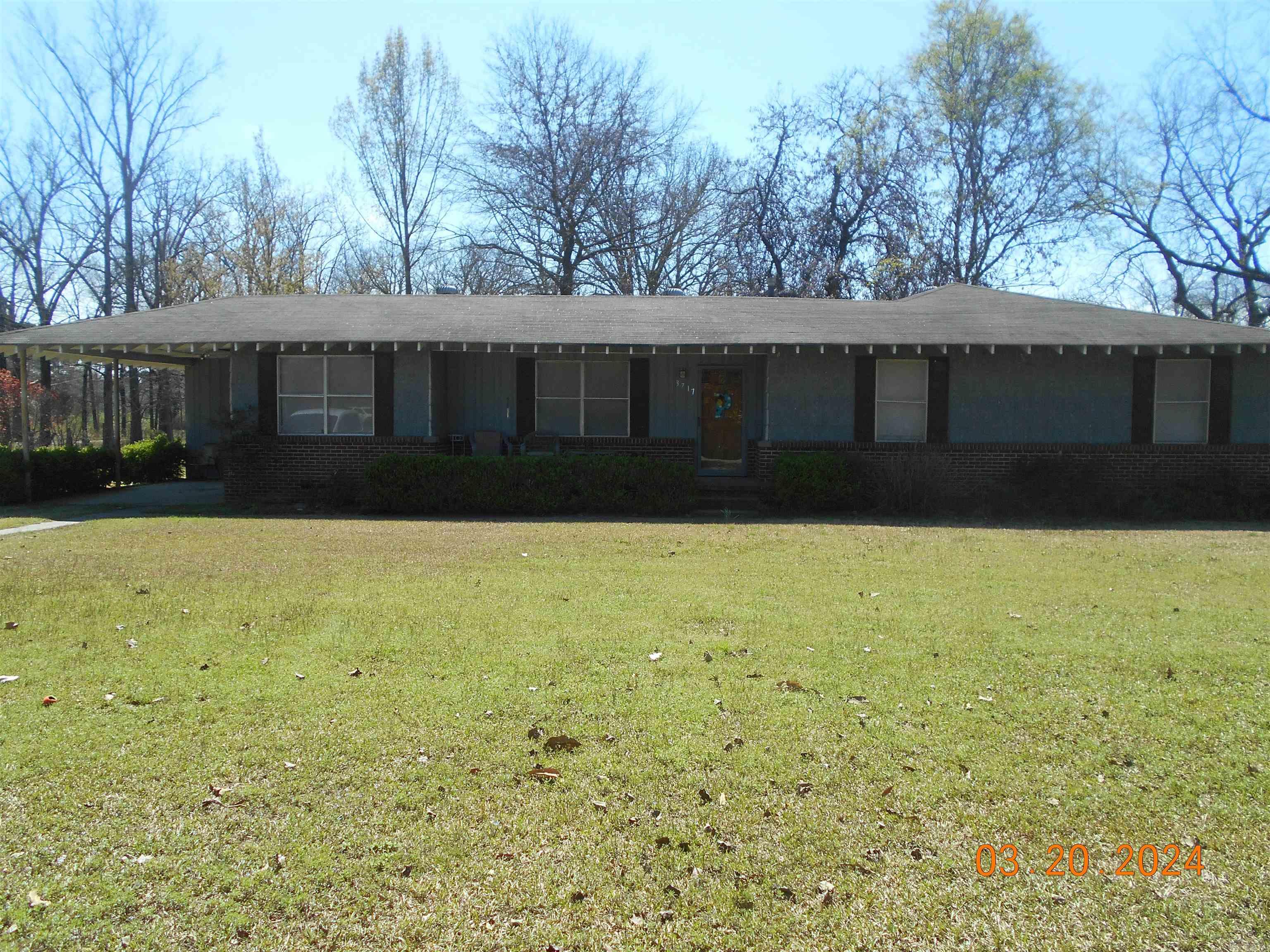 Nice Spacious home on 2.4 beautiful  acres with charming shady pecan trees.   This home offers four large bedrooms and has a closed in back porch and is perfect for your large family activities.  This rich land will be great for your family gardens.   Property sold AS-IS.   See Confidential Remarks!!  NO SIGN ON PROPERTY!!