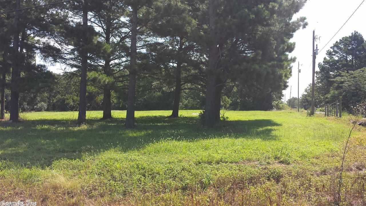 Nice 1.85 acre cleared tract on paved road right off the highway just minutes from town. There is a nice place to build a house. There is also an old septic in the ground and a concrete slab for a patio where a mobile home used to be located. The property also has good highway frontage if needed for commercial or business. There is more additional 8.5 acres of land that joins it on Hamrick Road also available.