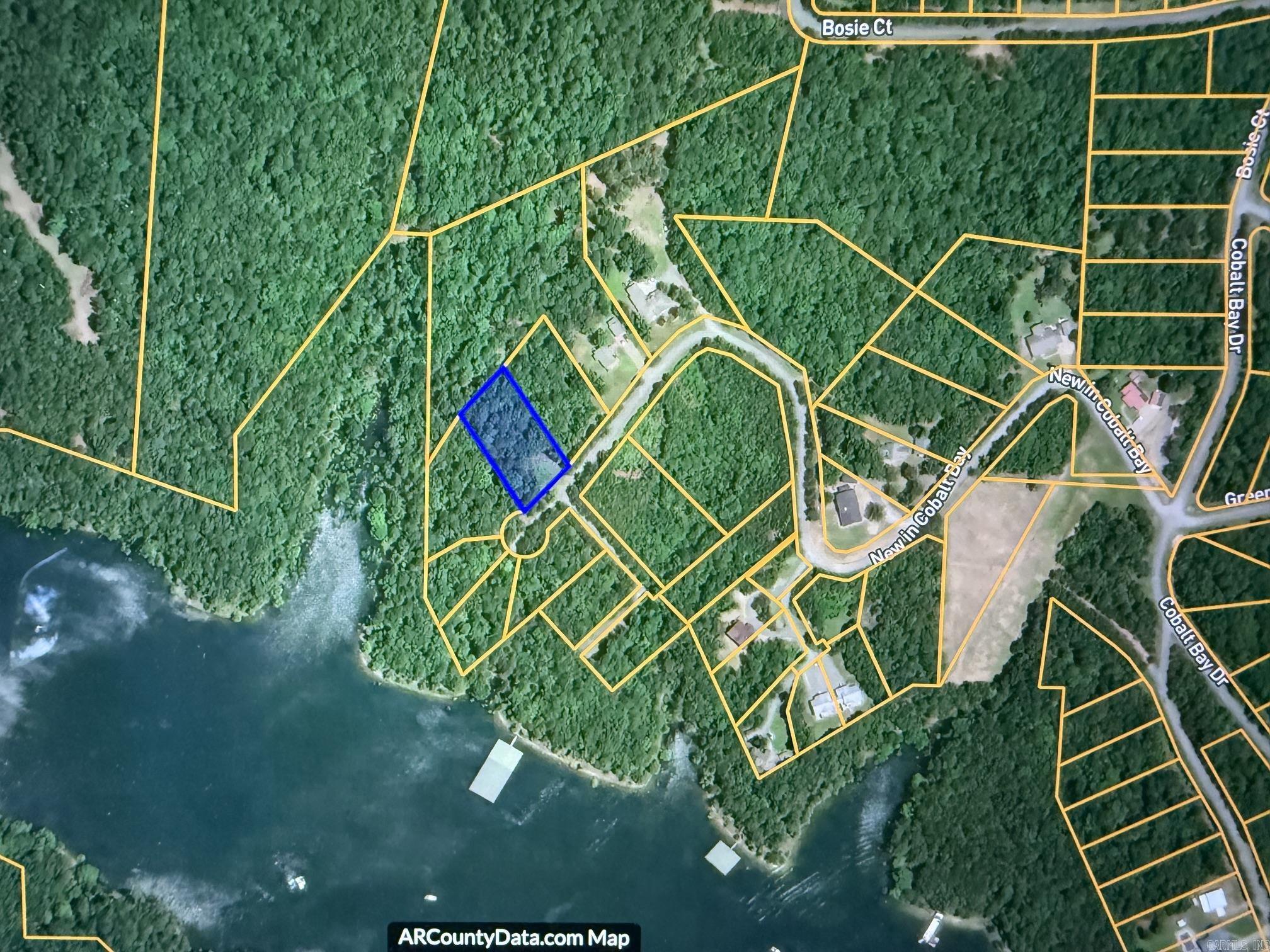 TWO BOAT SLIPS! come with this beautiful hillside lot in a very private lakeside community.  Just uplake from Fairfield Bay on the South Fork of Greers Ferry Lake.  Plan your dream vacation or retirement home while enjoying the convenience of two private slips in a small, community dock.