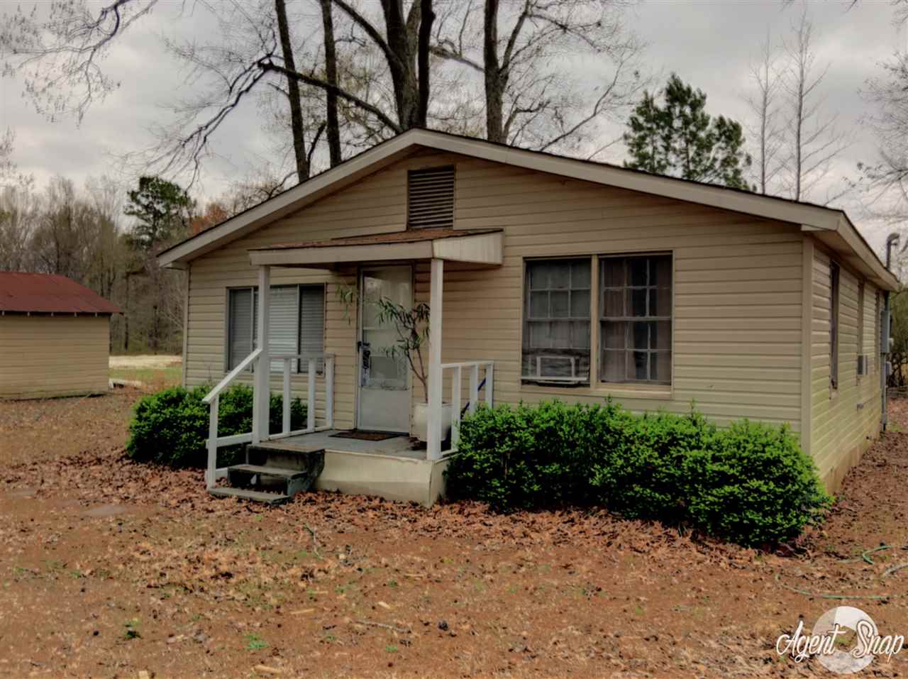 Great starter home, hardwood floors, bathroom & kitchen have been remodeled. Sitting on over 12 acres fenced & gated ~ pond & plenty of wildlife.