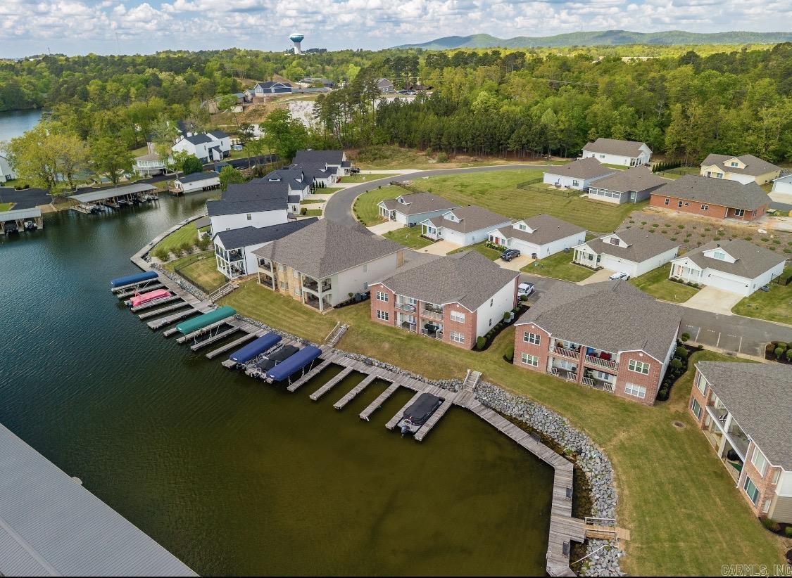Lakefront Condo on Lake Hamilton – Boat Slip Included! Wake up to Lake Hamilton water views in this 3-bedroom, 2-bath first-floor condo! Perfectly positioned for easy access, this walk-out unit lets you step right outside to your very own boat slip—ideal for lake living at its finest.  Property Highlights: 3 spacious bedrooms & 2 full bathrooms Furnished First-floor unit with direct walk-out access to the lake Private boat slip included  Lake views from your living space  Community Amenities at Clearwater Cove: Gated community for added privacy & security Boardwalk along the water Swimming pool Boat ramp conveniently located just outside the gate  Great Investment Opportunity: Minimum 30-day rental policy—ideal for steady income potential Perfect as a full-time residence, weekend retreat, or income-producing property  Whether you're looking for a peaceful place to call home or a relaxing lakeside getaway, this condo offers the best of both worlds.  Don’t miss your chance to own a slice of Lake Hamilton paradise—schedule your showing today!