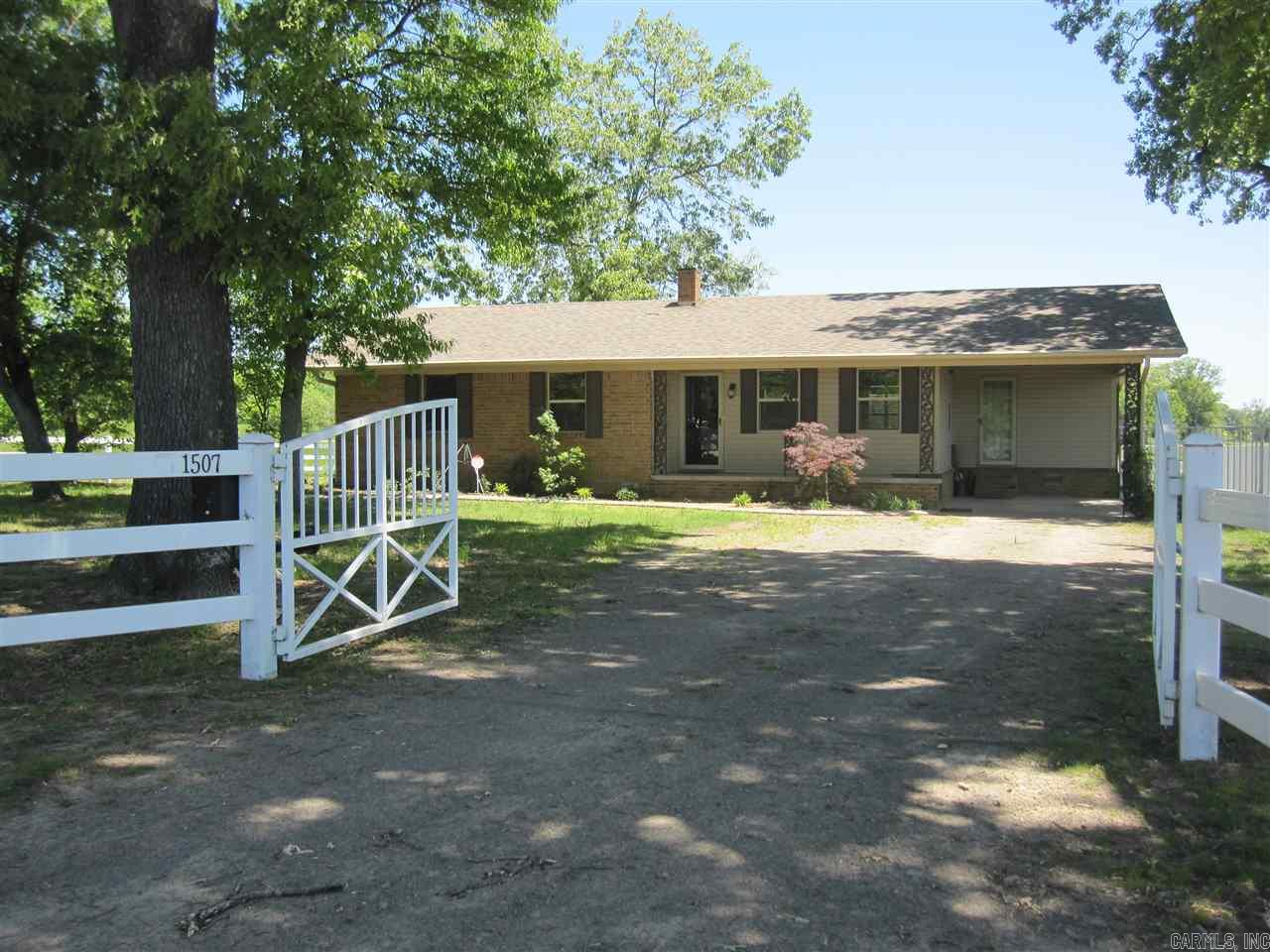 No expense spared with this newly remodeled home. Lots of high end finishes with new appliances and granite countertops. All bedrooms same side with two living areas. Hardwoods throughout. Beautiful flat acreage with pond, storm shelter & electric gate for privacy. Sq. Ft. approx. measuring encouraged.