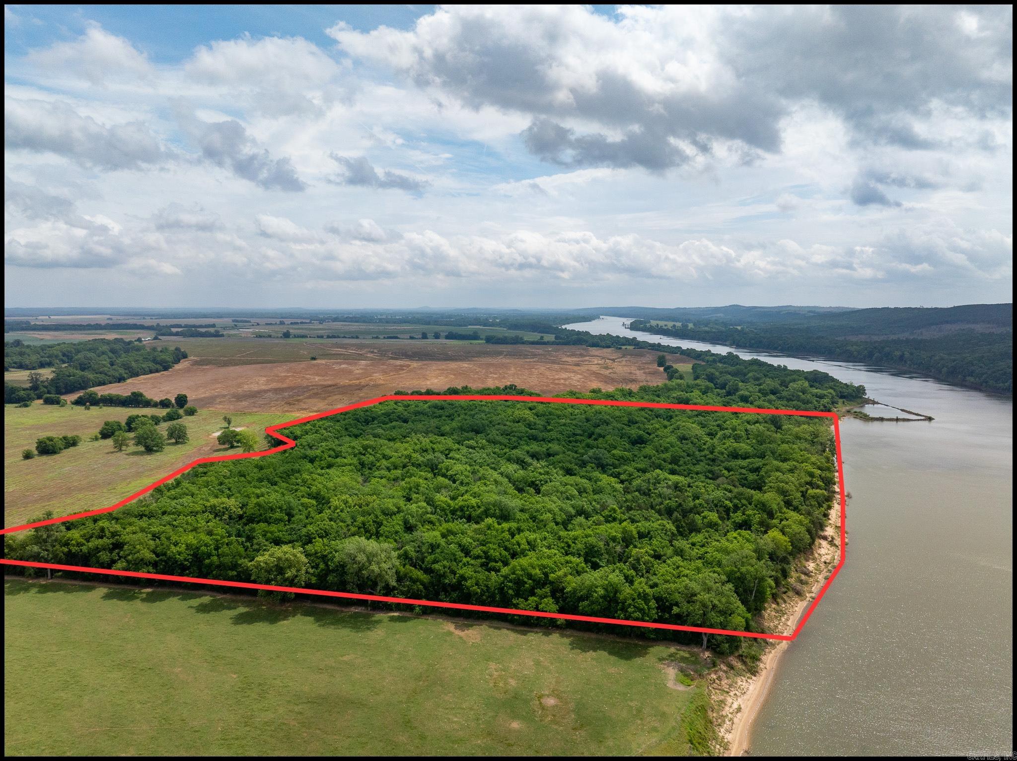 The Sandtown Bottoms Timber Tract is the affordable recreational property you've been searching for. Offering excellent deer hunting, mature timber, and access to outstanding fishing opportunities on the Arkansas River, this tract delivers exceptional value for outdoor enthusiasts.  Conveniently located near Morrilton and just minutes from I-40, the property provides easy access from Central Arkansas while maintaining the privacy and seclusion hunters and anglers desire. The combination of productive wildlife habitat and nearby river access creates a diverse recreational experience that can be enjoyed year-round.  22 miles from Conway, and 6 miles from Morrilton.  (Final price tbd by a new survey and price per acre.)