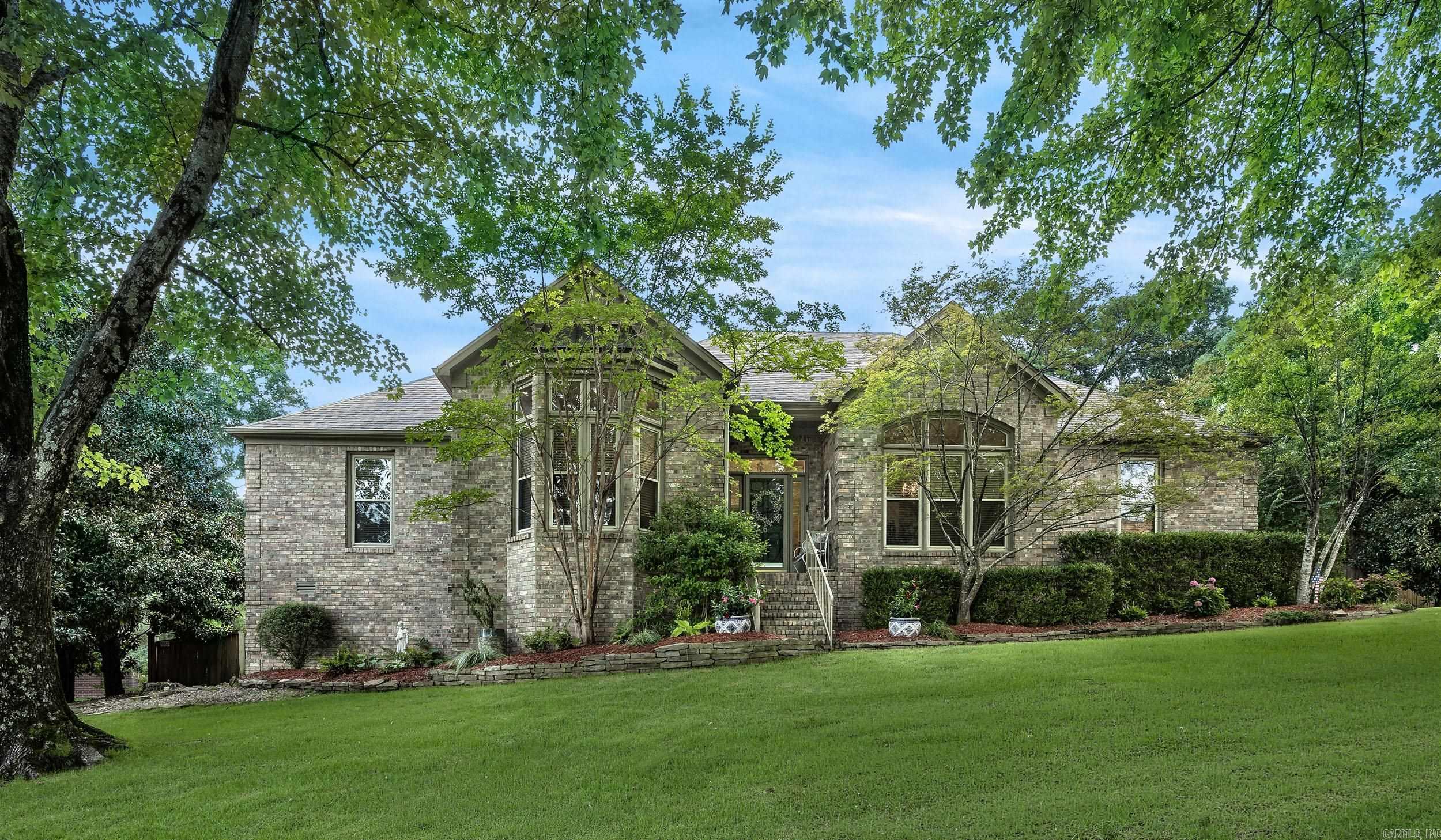 Rare one-level home with a private pool in Chenal Valley! This beautifully maintained 4-bedroom, 3.5-bath home offers an ideal layout with hardwood floors, formal dining, dedicated office, spacious living area with surround sound, and a chef's kitchen featuring Bosch appliances, abundant cabinetry, and a large island perfect for gathering. The private primary suite includes a spa-inspired bath and oversized walk-in closet, while three additional bedrooms provide plenty of space for family or guests. Step outside to your own backyard retreat with a saltwater pool, new liner, new sand filter system, refreshed landscaping, covered patio, and multiple entertaining spaces. Recent updates include one new HVAC unit, new refrigerator, newer water heaters (one just 6 months old), recently encapsulated crawl space, new tile in two bathrooms. In the three car garage  there's a hydraulic lift to the large floored attic for exceptional storage. Enjoy the luxury and convenience of Chenal Valley in one of the area's hardest-to-find floor plans!