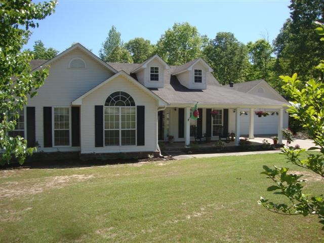 Wonderful home with wrap-around porch in country subdivision*4 bdrm, 3 ba on 2.45 acres*Great rm/WBFP with blowers*Formal dining room could be 5th bdrm or office*IN-LAW QUARTERS with kitchenette or suite down private hallway(wide doorways for handicap)*2 HVAC, 2 HWH, 2 septic systems*Shop in walk-out basement area is 12X18*GREAT HOME.....SEE ALL PHOTOS*