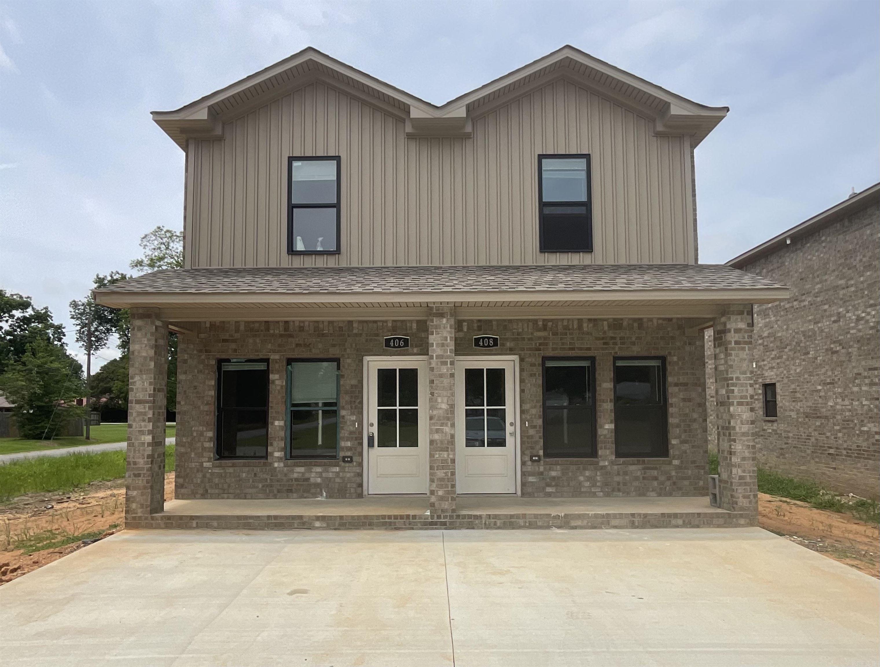 The PERFECT layout for roommates! Brick with a small facade of tan siding on front NEW CONSTRUCTION DUPLEXES in the heart of Lonoke! Each unit is 3bed/3bath! Front door opens into the downstairs living space with a full bath and bedroom at the back. Upstairs contains primary bedroom at the back with its own bathroom and an additional bedroom with a bathroom at the front! In between is the laundry, as well as a small bonus space! Luxury vinyl throughout will make this renter-ready! Completion estimated end of JULY! This building has several nearby multifamily buildings that will also be for sale soon! See AGENT REMARKS