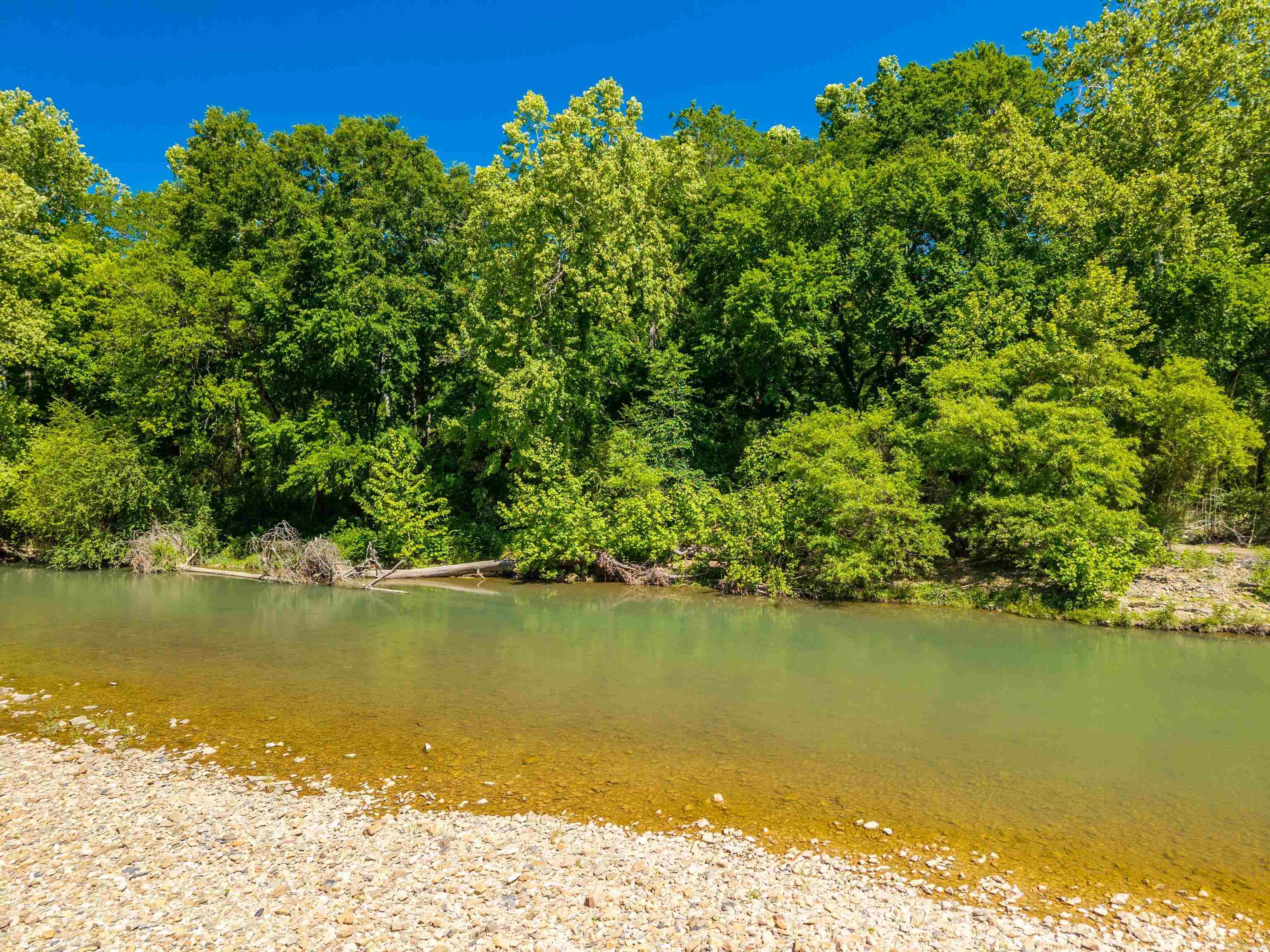 Affordable Paradise! Enjoy the relaxing quiet and tranquil peace that this secluded 5 plus acres on the Mazarn Creek offers. Perfect for a Cabin or Custom Home and can be used for Airbnb income also. Electricity and Public Water at the Property. Must see to appreciate.