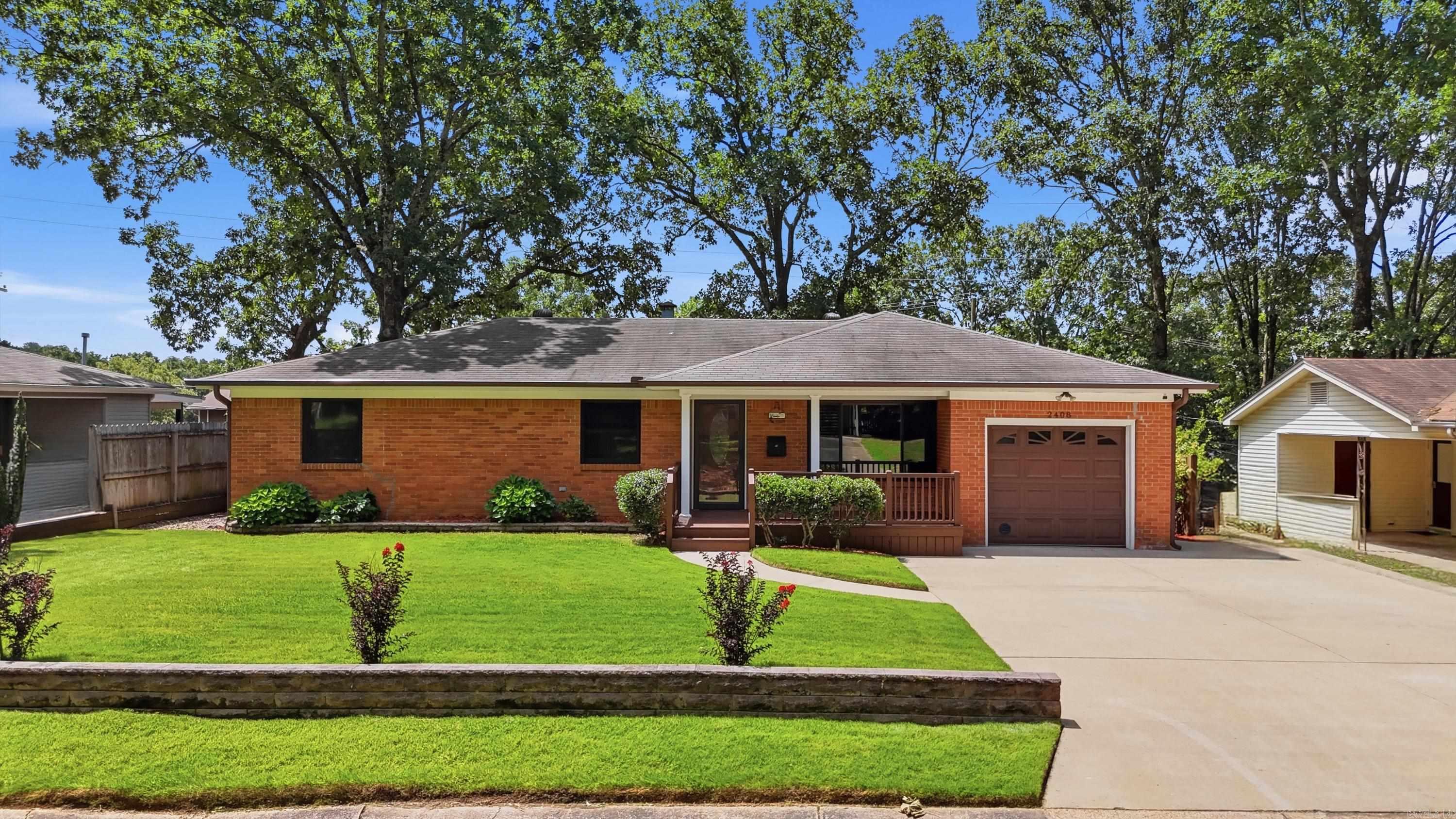 Don't miss this charming North Little Rock home in a convenient, established neighborhood!  Beautifully updated 4-bedroom loaded with upgrades and designed for comfortable living!  Features include brand-new carpet, tile flooring throughout the main living areas, granite countertops, fireplace, spacious living room plus den/dining area, breakfast nook, laundry room, and a luxurious primary suite with a whirlpool tub.  The kitchen is equipped with stainless steel appliances, including a stove with built-in air fryer, dishwasher, and microwave. Outside, enjoy a covered outdoor kitchen, screened-in porch, beautifully landscaped yard, fenced irrigated garden with greenhouse, finished and powered shop with covered patio, privacy fencing, and a multi-zone irrigation system with wifi!  Additional upgrades include an encapsulated crawl space with dehumidifier, whole-home generator (recently serviced, transferable warranty) all new low-E windows, security system, upgraded electrical panel, 6 inch leafguard gutters, finished garage with attic storage, and much more!  Move in with confidence—this home also includes a one year warranty!    Schedule your showing today and discover everything th