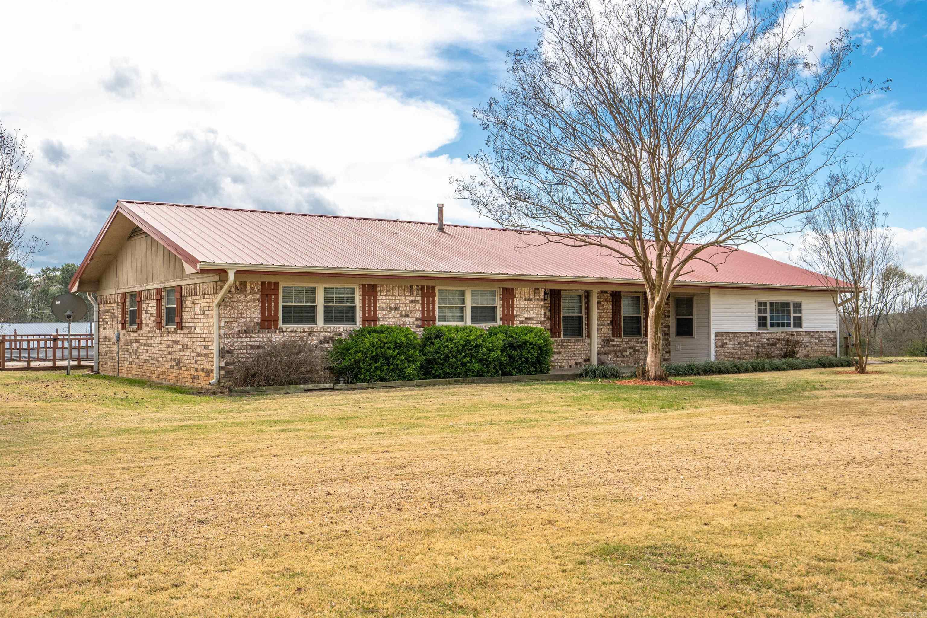 Welcome to 1276 Hwy. 84 W Umpire Ar.  This is beautiful brick home is located almost across the hwy to Athens Store. It is approx 8 mile to Shady Lake and Albert Pike Recreation ,for entertaining and catching trout,or just hanging out in beautiful natural habitat.   Home sits on 16.58 acres with 2 ponds,above ground pool, nice shed for storing tractor, boat, mower etc. Home has 2607 sq.ft. heated and cooled a metal roof. Large living room with brick fireplace, pellet heater installed. 3 bedrooms, 2baths. One bath has Jacuzzi for relaxing.    A huge bonus room to be great for entertaining, movie room for Thanksgiving and Christmas gatherings.   The Kitchen boast custom built cabinets with beautiful granite countertops and tile backsplash,a serving bar, granite with lights in above glass cabinet .Under counter lighting under all cabinets.   There is stainless side by side refrigerator,dishwasher,trash compactor, wall oven with microwave,gas cook top range in large island bar and a built in warmer drawer plus a very nice vent hood above stove.   There are 2 hot water heaters,one is a tank in laundry room other is tank less on demand