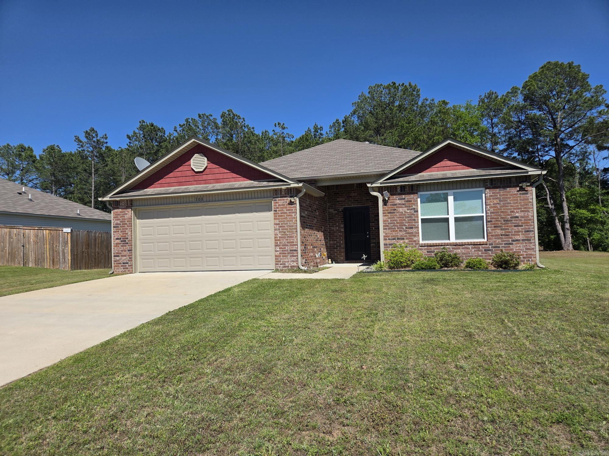 Nice spacious 4-bedroom, 2-bath recent build brick house with 2 car garage on a low traffic street at the edge of Beebe. This home has had solar panels added recently & will paid off at closing with acceptable offer. Seller states the electric bills are under $20 month. Sellers also added some window blinds. The kitchen has an island with bar, tile backsplash and a pantry. It has a separate laundry & open floor plan with the primary suite separate & on the back of the house. It also has a covered patio & a tree line in the back to separate properties. See agent remarks.